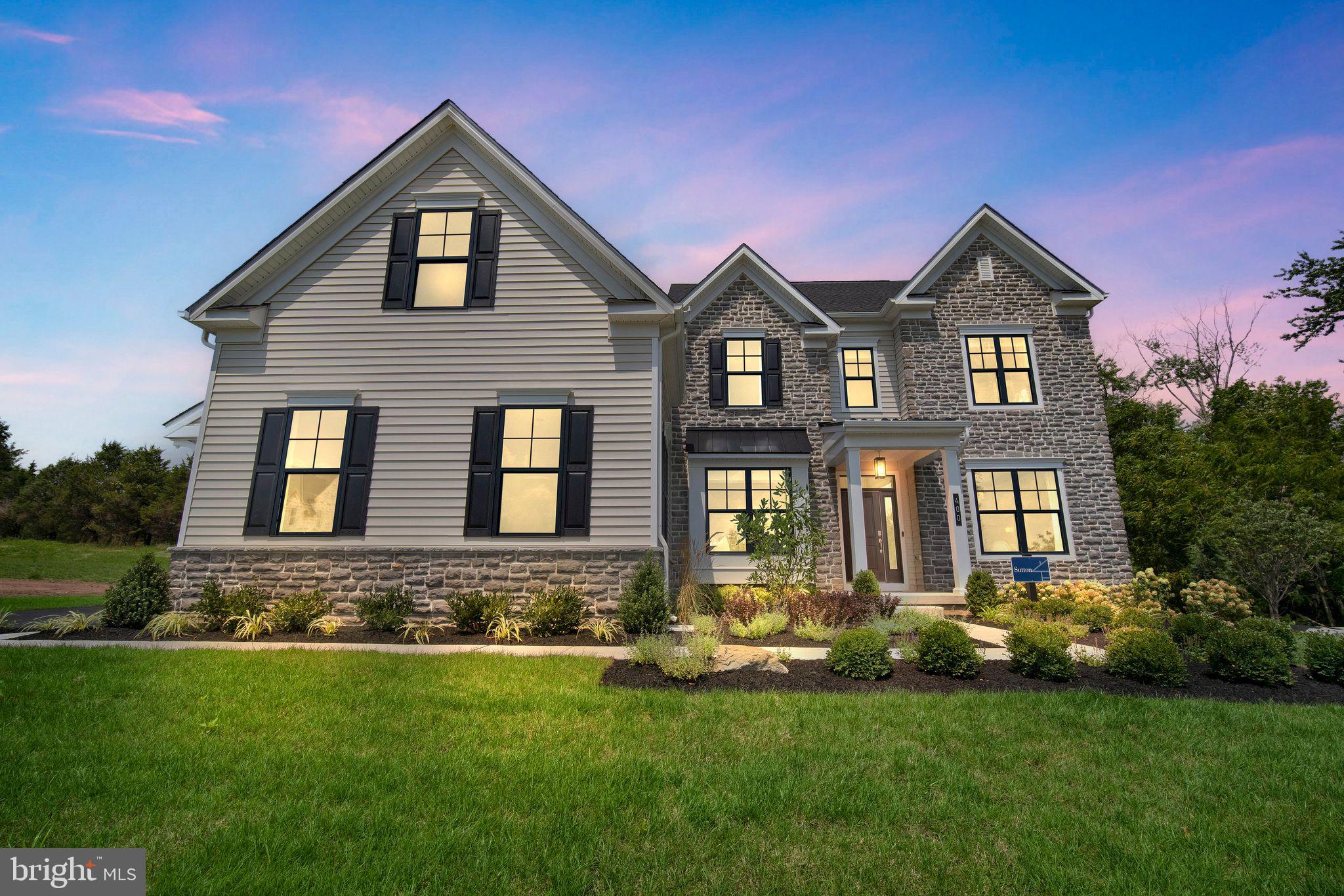 The Sutton floorplan features an impressive 4+ bedrooms, 3.5+ bathrooms, plentiful flex space, and so much more across its spacious 3,700+ sq. ft. of living space. Entering the home from the covered front porch, you are met by a welcoming foyer with tray ceiling that seamlessly connects to the formal dining room & private study. Airy 9' ceilings are found throughout the home, guiding you into the main living area comprised of a chef-inspired kitchen, eat-in breakfast area, and voluminous 2-story great room. This oversized kitchen is designed to entertain with its plentiful cabinetry, gorgeous quartz countertops, ceramic tile backsplash, dramatic central island, walk-in pantry, gleaming stainless steel appliances. Also found on this level is a convenient flex room, perfect for a private office or can even be converted into a 1st floor guest suite! Nearby, a convenient mudroom offers access to the 2+ car garage and laundry room.  Moving upstairs to the 2nd floor, you'll find double doors that lead you into the restful owner's suite, complete with 2 walk-in closets & a luxurious owner’s bath with dual sink vanity with gorgeous quartz countertops, private water closet, & spacious shower with bench seat. Also on this level are three additional bedrooms, one with an attached bathroom, & an additional full bath with double sink vanity. Fall in love with the extensive personalization that this dreamy floorplan offers, such as finishing the 9' basement, adding a deluxe guest suite or rear covered porch, and so much more to truly create your dream home. Set on a scenic hilltop in Upper Saucon Township, Strawberry Hill offers 20 luxury single-family homes. This picturesque neighborhood will feature an extensive lineup of thoughtfully designed floorplans, included designer features and finishes, and the opportunity to personalize your home into the space you’ve been dreaming of. Enjoy peaceful surroundings, a neighborhood walking trail, and access to the acclaimed Southern Lehigh School District—all while living just moments from local conveniences, major commuter routes, and the best of the Lehigh Valley. The photos and video are for illustrative and marketing purposes only and depict optional features or upgrades not included in the base price. The sale price reflects the base home only and does not include homesite premiums, upgrades, or options beyond the standard included features.