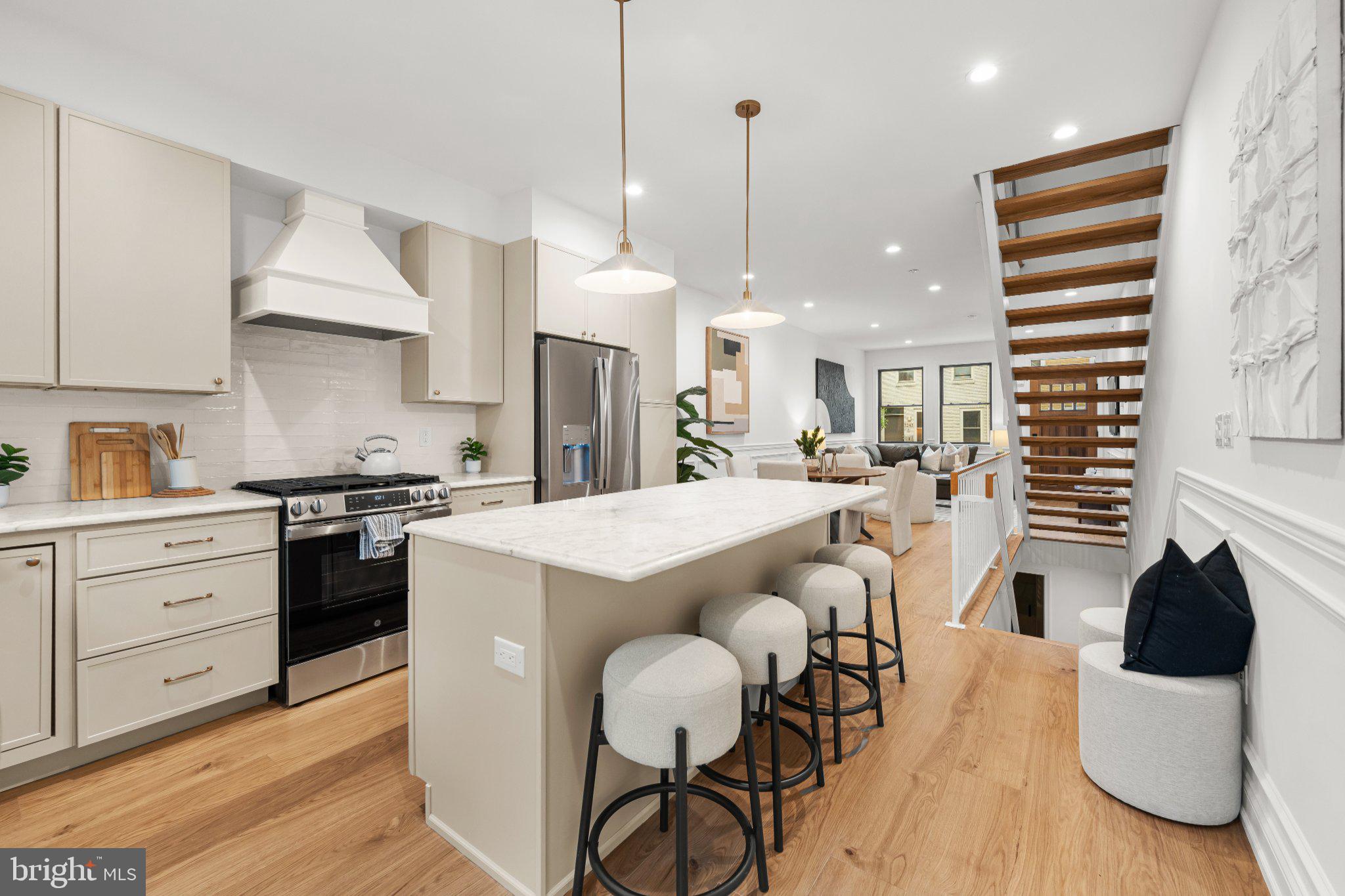 Seller is offering an interest rate 2-1 buy down reach out for more details. Welcome to 2240 Oakford Street, a stunning 2,100 sq. ft. custom-built home located in the heart of Point Breeze just two blocks from Washington Ave. This 3-bedroom, 3-bathroom new construction showcases exceptional craftsmanship and luxury living, with convenient access to Center City, Rittenhouse Square, and I-76. Step inside to an open-concept living area featuring engineered hardwood floors and a gourmet kitchen equipped with custom cabinetry, a spacious island, and stainless steel GE appliances. The private backyard is ideal for entertaining, offering artificial grass, and plenty of space for outdoor seating. The second floor features a large guest bedroom , a spacious walk-in laundry room with full sized side by side front load W/D included, a large hallway bathroom with a tub/shower and double vanity, and another generously sized bedroom at the end of the hall. The primary suite includes a luxurious bedroom, a massive walk-through closet with custom built-in shelving, and a spa-inspired bathroom with a double vanity and a large glass-enclosed shower. Just outside the primary bedroom, enjoy access to a front balcony or head up to the expansive rooftop deck, offering breathtaking panoramic views of the city skyline, stadiums, and bridges. The finished basement provides a full bathroom and flexible space for an optional fourth bedroom, office, or entertainment area. Additional highlights include a 10-year tax abatement and a 1-year builder’s warranty. Don’t miss this rare opportunity to own a luxury home in the vibrant Point Breeze neighborhood.