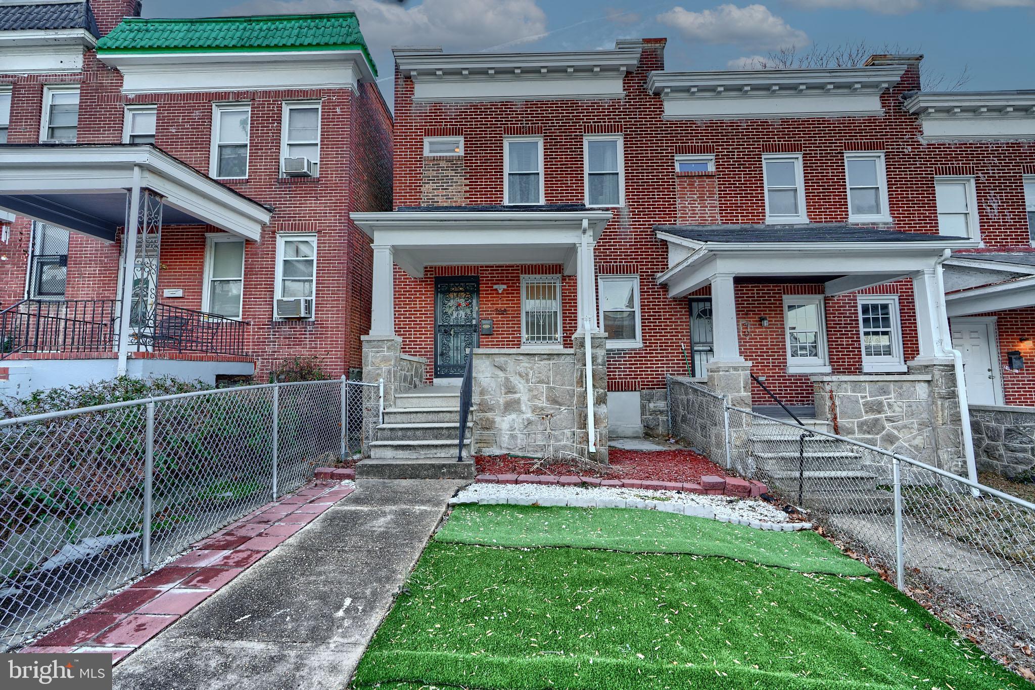 Lovely 3 bedroom 2 bath townhome with front porch and 2 car parking pad in rear. Natural hardwood flooring throughout main level great room, kitchen and 3 bedrooms on upper level. Finished lower level is carpeted. Kitchen has an island with granite countertop. 1 full bath on main level and 1 full bath on upper level. Must See!!!