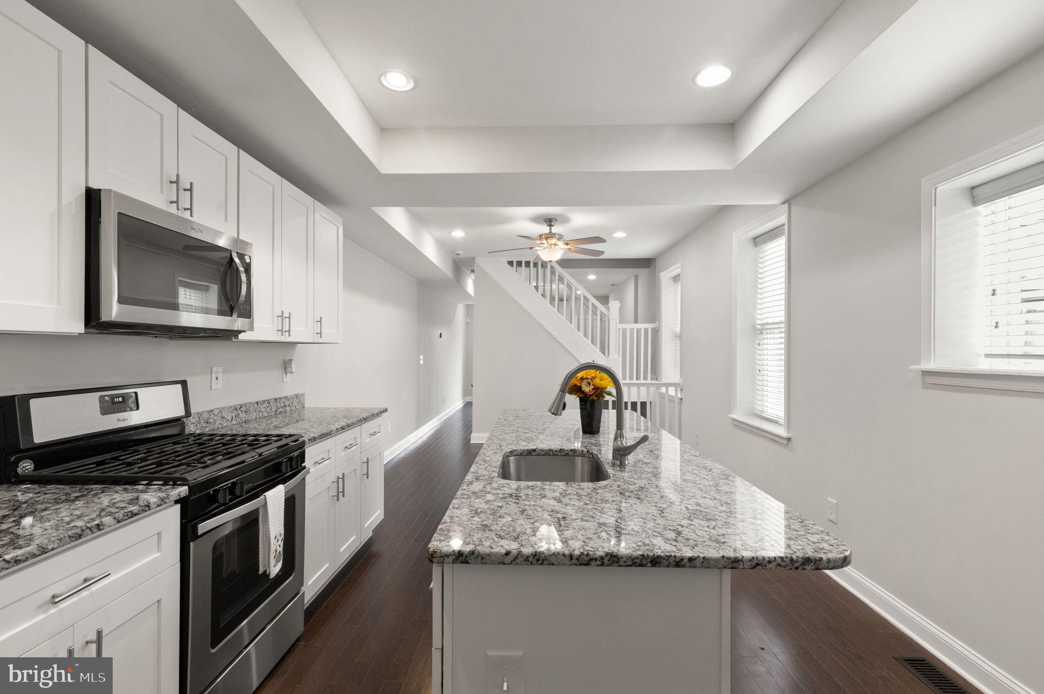 The One You've Been Waiting For has Finally Arrived! This meticulously renovated CHAP townhouse (2017) seamlessly blends timeless elegance with modern sophistication while offering OFF-STREET PARKING. Save THOUSANDS each year AUTOMATICALLY through the CHAP Certification. Just a few blocks from Patterson Park and nearby nightlife, this exquisite residence boasts 1,874 sq. ft. of beautifully finished space, featuring three spacious bedrooms and three and a half elegantly remodeled bathrooms. Inside you'll find the perfect blend of hardwood, tile and brand new carpeted flooring. The already brightly-lit home is further accentuated by recessed lighting, creating an inviting ambiance throughout. The gourmet kitchen is a chef's dream, equipped with high-end stainless steel appliances, upgraded countertops, and an expansive island perfect for entertaining. Retreat to the primary suite, a sanctuary of tranquility, complete with a luxurious en-suite bath and private deck space. The fully finished basement with walkout stairs offers additional living space, ideal for a home office or entertainment area. Outside, the sought-after private driveway ensures convenient parking all year round. A new roof (2022, with 15 year warranty), BRAND NEW HVAC (2026), and exterior doors (2017/2021) ensure you'll have peace of mind for years to come! Don't miss the opportunity to own this exceptional property combining luxury, comfort, and convenience. Your dream home awaits!