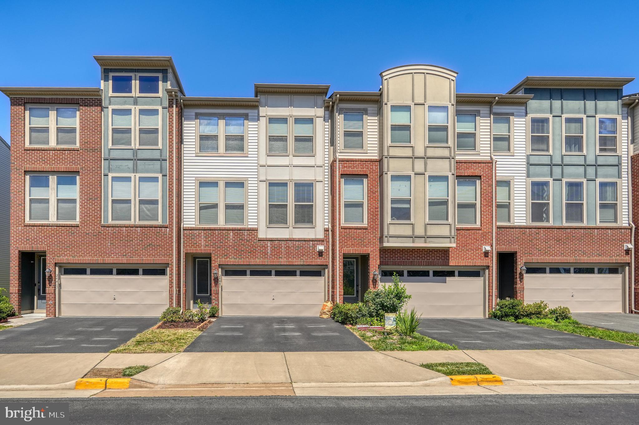 Welcome to this beautifully upgraded three-level townhome offering a two-car garage, finished walkout lower level, and a highly convenient Loudoun County location. Designed with flexibility and comfort in mind, this home features spacious living areas, modern finishes, and a layout that works well for everyday living, entertaining, guests, or working from home.

The main entry level offers a versatile recreation room along with a bedroom and full bathroom, making it ideal for guests, an in-law space, private office, gym, or additional living area. This level also provides convenient access to the garage and walkout access to the backyard.

The main living level features an open-concept design with wide-plank flooring, high ceilings, and large windows that bring in plenty of natural light. The kitchen is thoughtfully designed with upgraded cabinetry, granite countertops, stainless steel appliances, and a spacious layout that flows easily into the dining and living areas. Just off the main level, the rear deck provides a comfortable outdoor space for relaxing or entertaining, overlooking the fenced backyard with a hot tub area.

Upstairs, the bedroom level includes three well-sized bedrooms and two full bathrooms, including a spacious primary suite with generous closet space and a private bath.

Conveniently located near Dulles West Boulevard, Route 50, and Arcola Boulevard, this home offers easy access to major commuter routes, Dulles Airport, shopping, dining, daily conveniences, and major employment centers throughout Loudoun County and Northern Virginia.

Schedule your private showing today and experience the space, upgrades, and convenience this beautiful townhome has to offer.

Please note: Some photos may include virtual staging or digital enhancements, including the removal of personal belongings, to help better showcase the home’s potential.