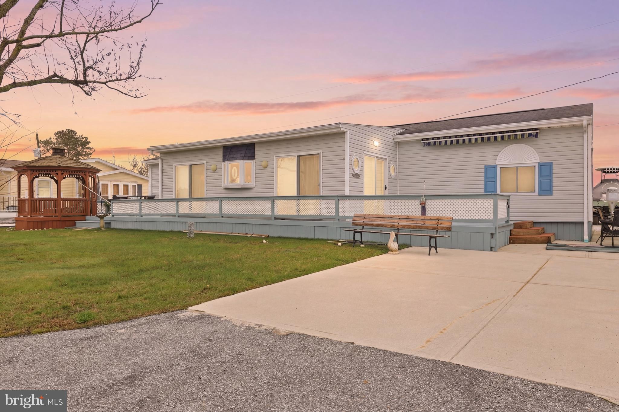 *Motivated Seller! Bring all offers!
Discover your perfect retreat in the Bay City community with this charming 2-bedroom, 2-bathroom home offering stunning direct water views of the canal leading to the Indian River Bay. Ideal for summer getaways or year-round living, this home is a water lover’s dream, featuring a boat dock and ramp.

Step outside to enjoy two spacious freshly painted decks with a new awning to be installed soon and a screened gazebo—perfect for relaxing or entertaining while taking in the serene surroundings. A storage shed provides ample space for your outdoor gear, and a concrete driveway adds convenience.

Inside, you’ll find a cozy den, an open kitchen and living room layout, and a laundry area for ease of living. New LVP flooring has been installed and some areas have been freshly painted. Both bedrooms come complete with their own bathrooms, ensuring privacy and comfort for you and your guests. 

Nestled in the tranquil Bay City community, this home is surrounded by nature and peaceful waters. You’ll be just minutes away from both Rehoboth and Lewes Beaches, with Longneck offering a variety of fantastic dining and entertainment options down the street. Don’t miss the opportunity to make this idyllic waterfront property your own!