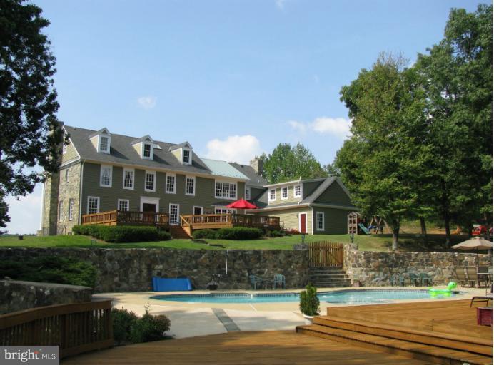 Welcome Home to Spacious and Comfortable Luxury in the Heart of VA Wine and Hunt Country!  Spectacular Private Setting provides Breathtaking Views!  High Ceilings, Hardwood Floors and Detailed Woodwork throughout!  Gorgeous appointments make this home Live Like a Dream!  An Entertainer's Delight as well!  Custom Pool, expansive decking, gazebo, full bar in basement!  Easy commuting access too!