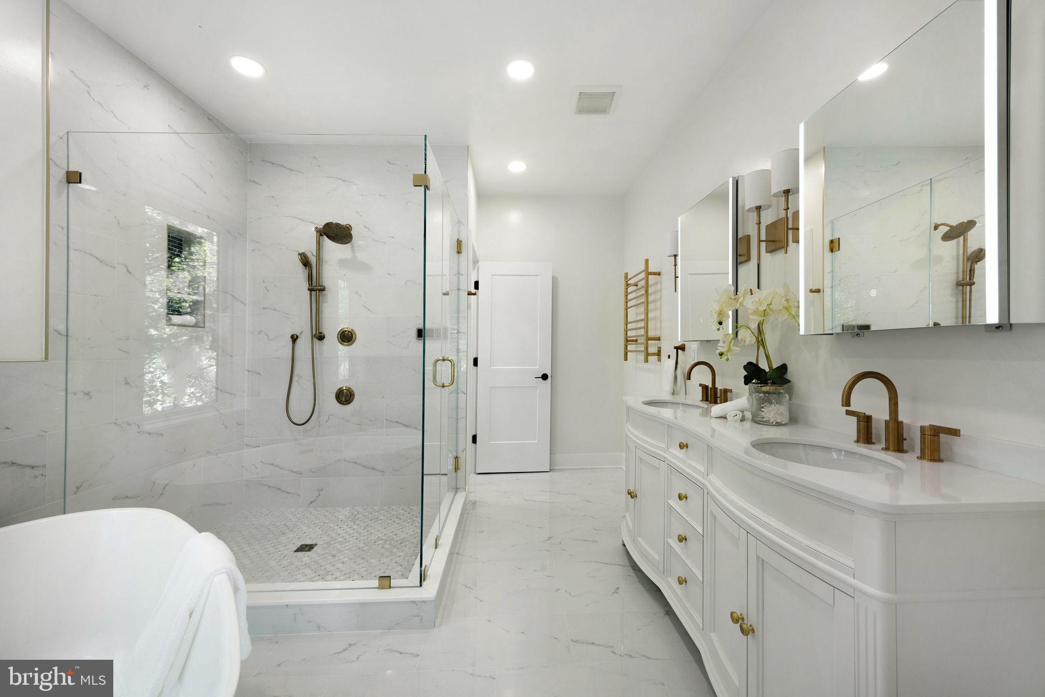 Discover a rare combination of privacy, natural light, thoughtful architecture, and everyday convenience just minutes from Washington, DC.

Wake each morning to the sunrise from your private second-floor balcony with a cup of coffee and your favorite book, then return home each evening to the peace and quiet of a tree-lined no-through street. Thoughtfully positioned on its homesite to capture morning light and maximize privacy, this is a home designed to be experienced as much as admired.

Nestled on a beautifully wooded 10,000-square-foot homesite, this newly completed custom residence offers over 4,400 finished square feet, 6 bedrooms, 6 full baths, and a flexible floor plan designed for the way people live today. A sought-after main-level bedroom and full bath provide exceptional flexibility for guests, multigenerational living, a private office, or future aging-in-place. The detached garage also offers future ADU potential (subject to City of Alexandria approval), creating opportunities for a guest residence, multigenerational living, a private office, or rental income.

Designed by award-winning architectural designer Jina Moussavi and built by K-One Design Build, the home reflects a commitment to thoughtful architecture, enduring craftsmanship, and long-term quality. Every significant design and construction decision was guided by sound architectural principles, functionality, and lasting performance. The structural system was engineered for the site's conditions, while expansive windows, carefully proportioned spaces, and intentional room placement create interiors filled with natural light and peaceful views of the surrounding trees.

Quality extends throughout the home. Solid hardwood flooring spans the main and upper levels instead of carpet, offering timeless beauty and the ability to be professionally refinished for generations. The lower level features durable luxury vinyl plank flooring, creating a completely carpet-free home. Full spray foam insulation and high-performance construction further enhance quietness, comfort, and energy efficiency.

At the heart of the home is a chef-inspired kitchen designed for both entertaining and everyday living, featuring a quartz island, induction cooktop, double wall ovens, pot filler, butler's pantry, walk-in pantry, and dedicated wine and coffee bar. Open gathering spaces flow effortlessly to the private backyard, making it equally suited for entertaining guests or enjoying quiet evenings at home.

Upstairs, every bedroom features its own en-suite bath and walk-in closet. The primary suite serves as a private retreat with a spa-inspired bath, soaking tub, spacious walk-in shower, towel warmer, and custom walk-in closet. The finished walk-up lower level adds exceptional flexibility with a recreation room, wet bar, full bath, and space for a guest suite, fitness room, media room, or additional bedroom.

Located on a quiet no-through street with a signalized entrance onto Duke Street, the home combines a peaceful setting with convenient access to Del Ray, Old Town Alexandria, Washington, DC, National Landing, the Pentagon, Metro, and Reagan National Airport. Positioned within Alexandria's rapidly transforming West End, the property stands to benefit from billions of dollars in public and private investment, including the future Inova Alexandria Hospital campus, Landmark redevelopment, transportation improvements, and expanding retail and dining destinations.

A recent independent third-party appraisal supports the current asking price, and specialized financing programs may be available for qualified medical professionals and licensed attorneys through participating lenders.

132 N Earley Street was designed with one goal in mind: to create a home that feels just as exceptional decades from now as it does the day you walk through the front door.