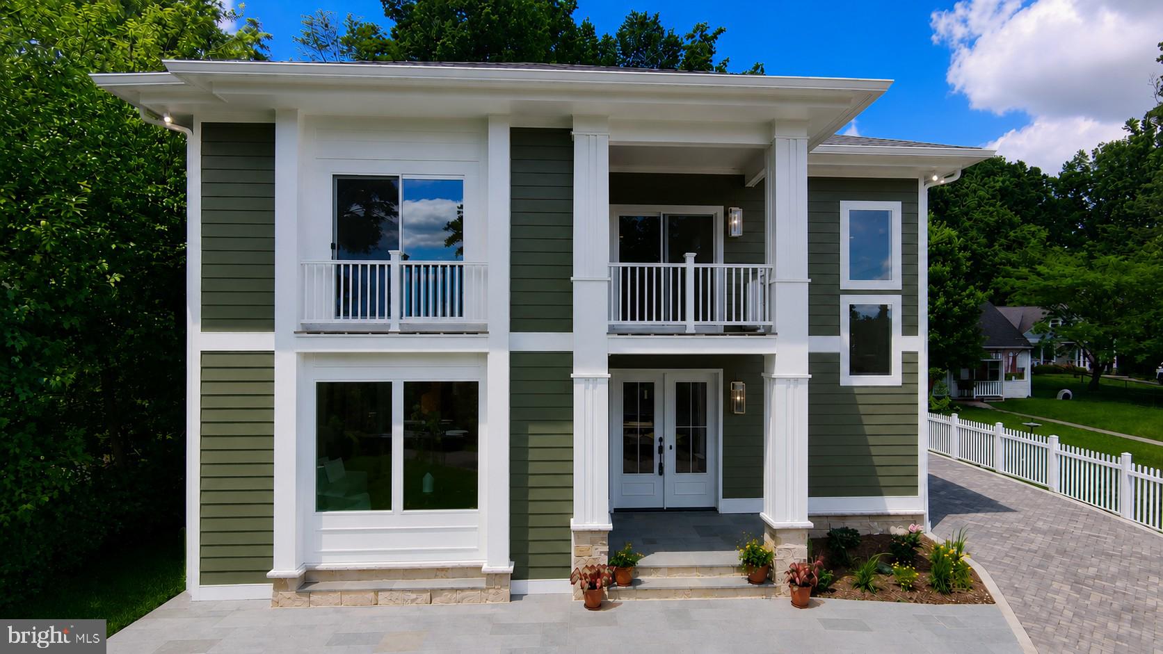 A rare opportunity to own a newly completed custom home offering something increasingly difficult to find in Northern Virginia: a private, tree-lined setting with a usable yard, exceptional natural light, and easy access to the places people use most.

Tucked away on a quiet no-through street in Alexandria City, this thoughtfully designed residence combines the feeling of a secluded retreat with the convenience of being minutes from Del Ray, Old Town Alexandria, Washington DC, National Landing, Metro, Reagan National Airport, and the future Inova Alexandria Hospital campus.

Located within Alexandria's rapidly evolving West End corridor, the property stands to benefit from substantial public and private investment already underway, including new healthcare facilities, retail, housing, transportation improvements, and neighborhood enhancements that continue to transform the area.

Designed by award-winning architect Jina Moussavi and built by K-One Design Build, the home was planned around natural light, architectural flow, quietness, and long-term livability. Unlike many newer homes that prioritize maximum square footage, this residence focuses on how people actually live and enjoy their homes every day.

A main-level bedroom and full bath provide flexibility for guests, multigenerational living, a private office, or future aging-in-place needs. Combined with six bedrooms, six full baths, and over 4,400 finished square feet, the home offers the adaptability today's buyers increasingly seek.

Walk to neighborhood parks, bike to Del Ray, enjoy an afternoon in Old Town, commute easily to DC, and return home to a peaceful setting that feels remarkably removed from the pace of the city.