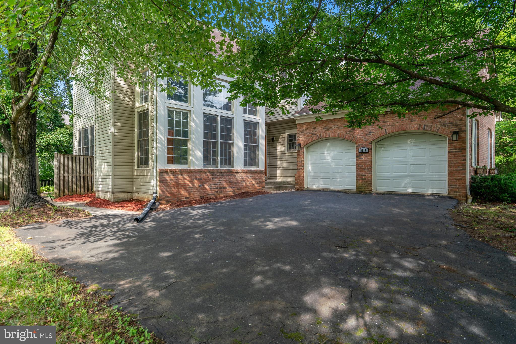 Stunning 4 BR, 3.5BA detached Colonial on a quiet cul-de-sac! Features a dramatic 2-story foyer, gleaming hardwoods, new carpet, and a private office with built-ins. Chef's gourmet kitchen boasts Quartz counters, new Frigidaire appliances, 5-burner gas stove, and Kohler sink. Enjoy a sunken living room & family room each with a gas fireplace! Slider leads to a deck/patio. 1st-floor laundry. Luxurious primary suite with soaking tub & separate shower, plus 2 additional upper bedrooms overlooking the main level. Finished walkout basement includes a rec room, workout room, 4th BR, wood-burning fireplace, full BA and outside exit, 2-car garage + 3-4 car driveway. Prime location near B/W Parkway, NASA, Greenbelt, Glen Dale, shopping and transit