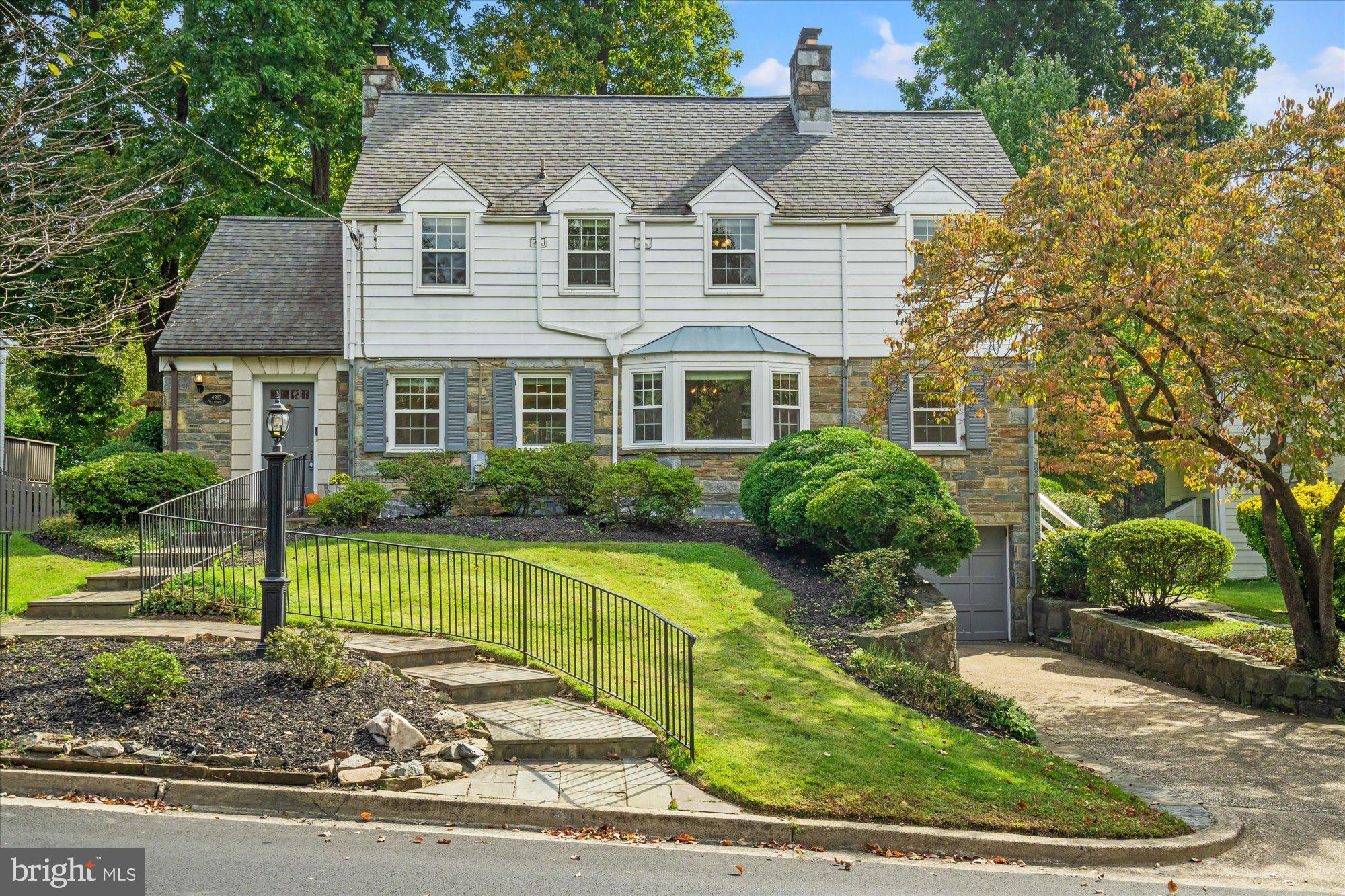 Amazing new price!  Attractive stone and wood frame colonial in desirable Sumner.  Features include a sun-filled and expanded main level, updated kitchen addition with stainless steel appliances, large breakfast/family room with built-ins opening to large deck and deep, fenced backyard, living room with built-ins, wood-burning fireplace with mantel opening to sitting/sun room, den/office with wood-burning fireplace with adjacent full bath, laundry room off kitchen with an additional refrigerator and side-by-side, front loading washer and dryer. The upper level features the primary bedroom with sitting room/bedroom and adjoining bath, 3 additional bedrooms, hall full bathroom with tub.  All bedrooms have ceiling fans. The lower level offers a  playroom/family area plus additional full bath and extra room perfect as an office/computer room.  Windows have been replaced. Roof replaced in 2018.  Heat pump replaced in 2023.  Convenient location just minutes to the Capital Crescent Trail, Westbard Shopping Center and Little Falls Mall.  Beautiful azaleas in front and back of house.  Some of the rooms have been virtually staged.