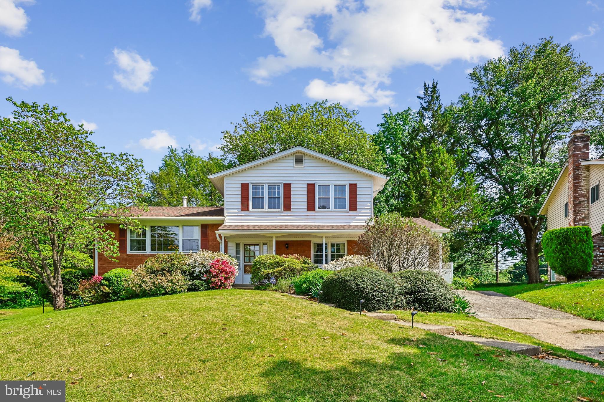 Discover the charm of this beautifully maintained split-level home nestled in the desirable Paint Branch Estates. This property offers ample outdoor space for gardening, entertaining, or simply enjoying the tranquility of nature; a perfect blend of comfort and functionality. Built in 1965, the property exudes a warm, inviting atmosphere, ideal for creating lasting memories. With shining wood floors and easy flow, entertaining is a joy. The wood burning fireplace, complete with tools, creates a delightful room for relaxation and a wall of windows to enjoy the spring blossoms and birds nesting. The wet bar is perfectly situated between the family room and kitchen to conveniently grab sodas and hard lemonades for your next family gathering. The formal dining room is large enough to put in all the leaves to your table! And extra space in the living room for the ‘kids’ table. With three spacious bedrooms and two full bathrooms on the upper level, this home accommodates daily routines with ease. Use the main floor bedroom [new carpet] as an office, den or guest room; the powder room is just across the hall. The lower level walkout basement offers a large laundry room with room for a workbench, tools and storage. The finished basement, with large vinyl floor tile, is an ample play room, perfect for gaming, crafts or entertainment. Set on a generous 0.41-acre lot, the exterior features a well-maintained frame structure complemented by a practical gutter system, ensuring peace of mind during rainy days. The attached carport provides convenient shelter for your vehicle, while the concrete driveway offers ample space for additional side-by-side parking. Step outside to discover a serene backyard, perfect for outdoor gatherings or quiet moments of reflection. A handy shed adds extra storage for gardening tools or recreational equipment, enhancing the home's practicality. Updates include: roof,  refrigerator, microwave, HVAC, siding, wet bar & flooring. This property is not just a house; it's a place to call home, where comfort meets convenience. Experience the warmth and potential of this inviting residence, ready for you to make it your own.