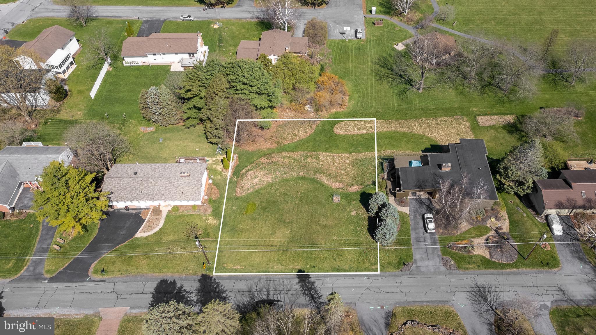 Nestled in the beautiful Kaywood neighborhood, this exceptional lot offers the perfect setting to build your dream home. Backing to the Kaywood park and showcasing stunning views of Mount Nittany, the property allows for a walk-out lower level—ideal for thoughtful, long-term living. Enjoy a peaceful setting just minutes from the historic town of Boalsburg and only 15 minutes from downtown State College and Penn State University. The availability of public water and sewer adds ease and flexibility for future development.