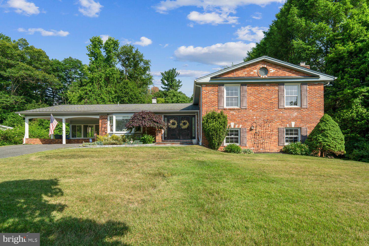 Welcome to this lovingly maintained, one-owner, 4-level split in the highly sought-after Drumeldra Hills community! Situated on an expansive nearly ¾-acre lot, this spacious 5 bedroom, 3 full bath split-level home offers timeless character, beautiful hardwood floors, and a distinctive mid-century modern feel. Enjoy peace of mind with a new whole-house generator (2025) and newer hot water heater (2024). The main level features a bright and inviting living room, a formal dining room accented with elegant dentil molding, and kitchen with upgraded countertops. Just off the dining room, the sunroom provides the perfect place to relax while overlooking the backyard and offers direct access to outdoor living spaces. Upstairs, the spacious primary suite features two closets, a dressing area, and a private en-suite bath. Three additional generously sized bedrooms and a full hall bath complete the upper level. The lower level offers exceptional flexibility with a large family room centered around a cozy wood-burning fireplace, a fifth bedroom or flex space with an oversized walk-in closet, a full bath, cedar closet, and laundry room. An unfinished basement provides abundant storage space. Ideally located with convenient access to the ICC, shopping, dining, and commuter routes. Enjoy nearby recreational and cultural attractions including Brookside Gardens, Wheaton Regional Park, and the National Capital Trolley Museum. Offering space, character, and an unbeatable location, this is a rare opportunity to own a truly special home.