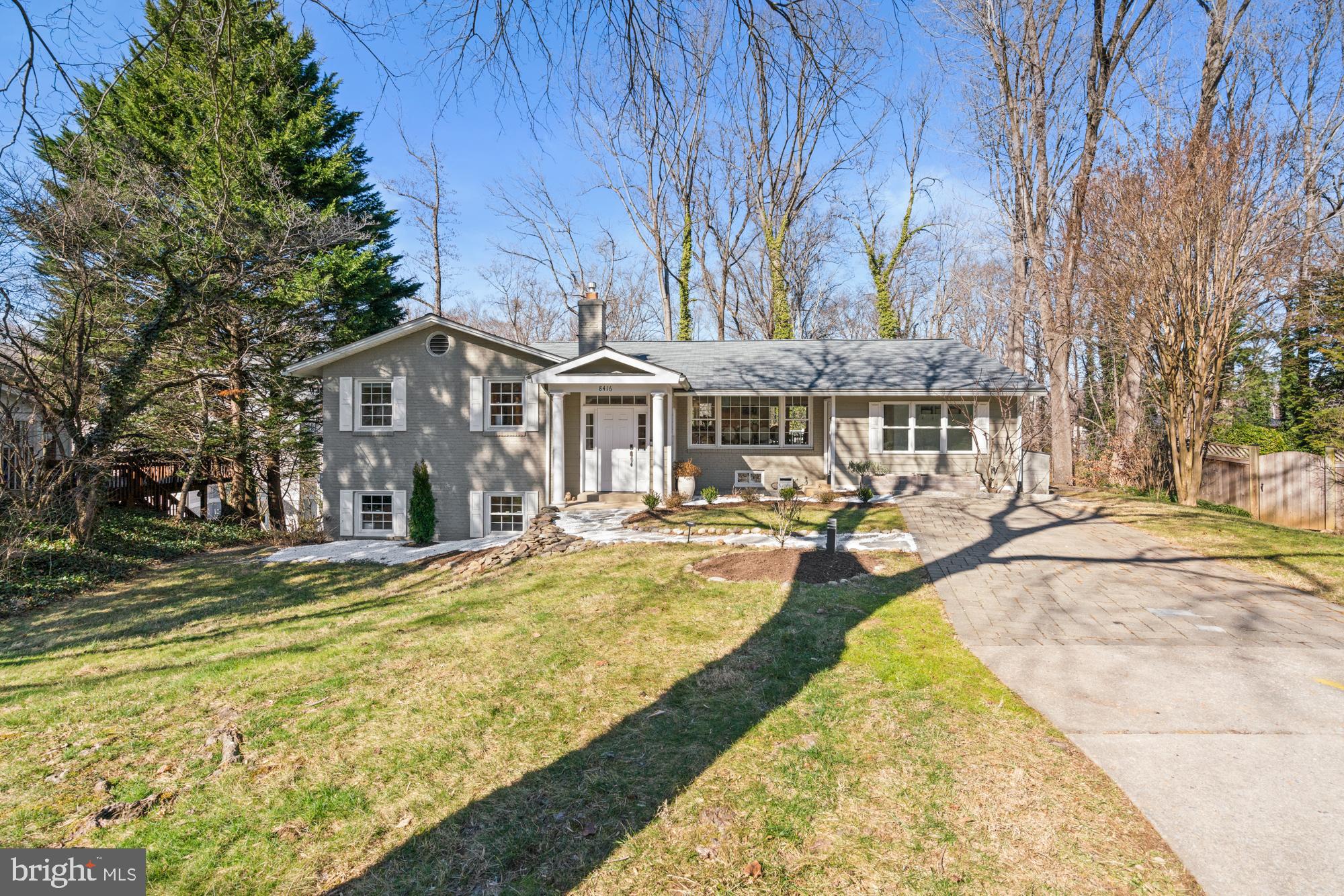Seller is asking to review any offers Tuesday, Feb 13 at 3:00 p.m. Centrally located in the idyllic Woodhaven neighborhood of Bethesda, this beautifully updated and expanded home spans over approximately 3,600 square feet of living space on two finished levels, boasting excellent flow and natural light. The cul-de-sac location, along with the flowering shrubs and mature plantings that adorn the landscaped lot, promotes the serene environment. A winding path leads to the covered front entry and a dedicated foyer. The flexible floor plan is highlighted by the rarely found, open concept main floor that gleams with designer touches like bleached hardwood flooring, expansive windows, and whimsical accents throughout. The chef’s kitchen is anchored by a large picture window overlooking the garden and woodlands. With stainless steel appliances, a center island, and a breakfast bar, the kitchen opens to both the dining and living rooms. Two sets of sliding glass doors lead to a wrap-around Trex deck with fantastic views of the expansive, professionally landscaped backyard. Additional offerings include a quiet study, as well as a custom mudroom accessed by a front side door, creating excellent flow into the home. Three of the four bedrooms and two full baths are located on the main level, including the primary bedroom complete with a custom walk-in closet and a renovated en-suite bathroom with dual sinks. In the lower level, the walk-out family room is ideal for entertaining with its gas fireplace and easy access to the backyard. Plan a family movie night or work out in peace in the second recreation room which is highlighted by a cheery custom accent wall. The fourth bedroom with a renovated en-suite bathroom and laundry, wine room, and another custom storage room completes the lower level.  New owner has option to join Palisades Pool, the original swimming club of Katie Ledecky! (New owner qualified as a bond member, no wait list.) 8416 Westmont Terrace enjoys a supreme location close to the shops and restaurants of downtown Bethesda, as well as major transportation routes, the Metro, NIH, and Walter Reed Medical Center. Inbounds for Walt Whitman, Pyle, and Burning Tree schools.