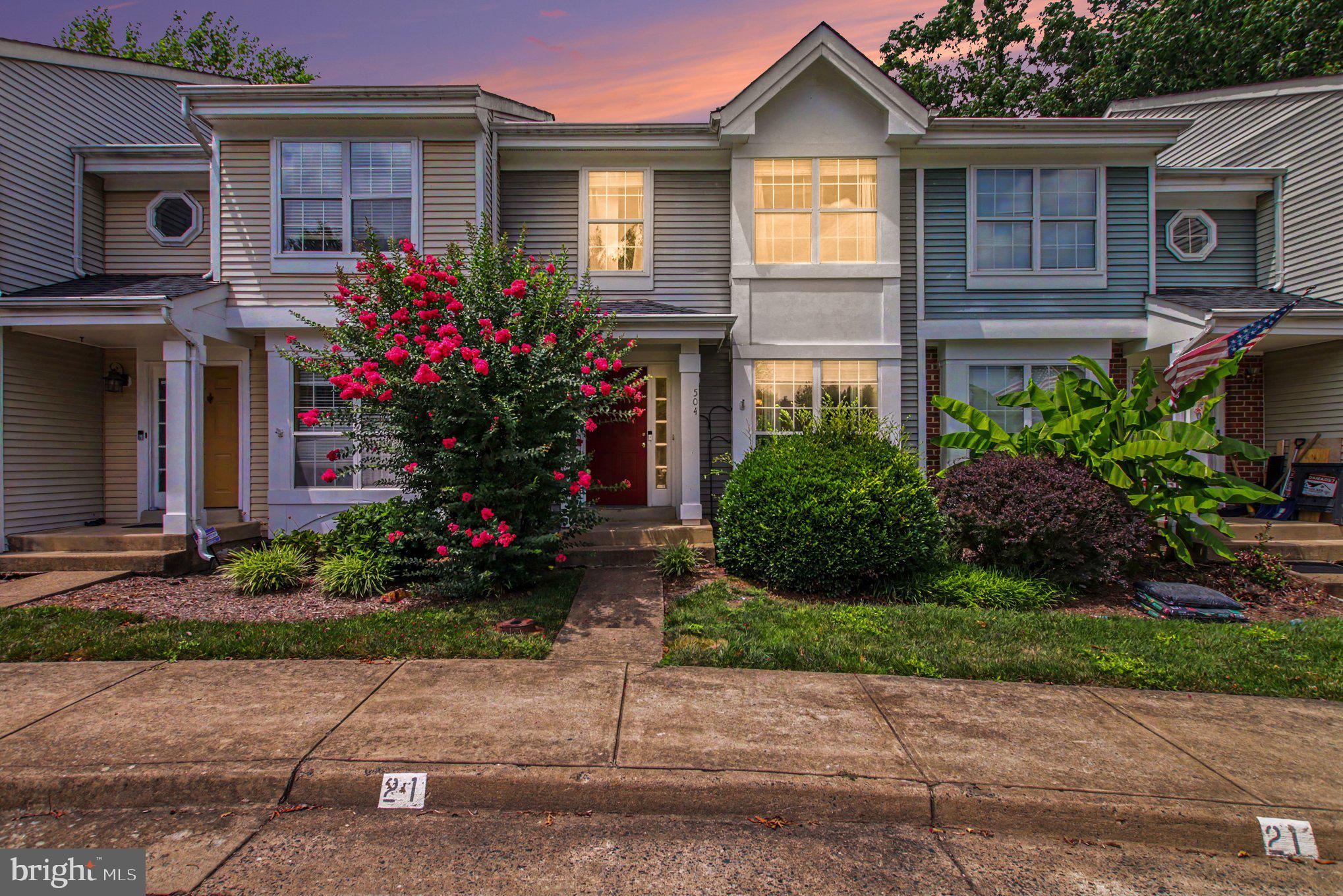 **Ask about our aggressive buyer incentives.** Welcome to 504 Providence Street, a beautifully maintained townhome that perfectly blends comfort, convenience, and scenic surroundings. Nestled in a sought-after community, this home offers peaceful pond views, modern updates, and an unbeatable location just minutes from shopping, dining, recreation, and major commuter routes.
From the moment you arrive, you'll appreciate the charming curb appeal and welcoming front entry. Inside, the spacious main level features durable hardwood flooring, an open-concept layout, and an abundance of natural light that creates a warm and inviting atmosphere. The large living room flows seamlessly into the dining area and kitchen, making everyday living and entertaining effortless.

The kitchen offers ample cabinet and counter space, stainless steel appliances, a convenient breakfast bar, and easy access to the rear deck—perfect for enjoying your morning coffee while overlooking the tranquil pond. The elevated deck provides one of the home's most desirable features, offering relaxing views of the large community pond and creating the perfect setting to unwind after a long day.

Upstairs, the spacious primary suite features vaulted ceilings, generous closet space, and a beautifully updated en-suite bathroom. A custom tile feature adds a unique designer touch, while upgraded fixtures and hardware throughout the home provide a fresh, modern feel. Two additional bedrooms and another full bathroom complete the upper level, offering comfortable accommodations for family, guests, or a home office.

The fully finished walk-out lower level expands your living space with elegant wall-to-wall tile flooring and endless possibilities. Whether you envision a recreation room, media room, home gym, playroom, or guest retreat, this flexible space provides direct access to the private fenced patio for seamless indoor-outdoor living.

This home has been thoughtfully updated for peace of mind, including an HVAC system replaced approximately 4–5 years ago and a roof replaced approximately 2–3 years ago. Additional improvements include wall-to-wall tile flooring throughout the lower level, custom tile detailing in an upstairs bedroom, and upgraded lighting, plumbing fixtures, and hardware that enhance the home's overall appeal.

The location is equally impressive. Commuters will appreciate the nearby commuter lot and quick access to I-95, with Quantico just approximately 15 minutes away. Everyday conveniences are just around the corner with an abundance of shopping, restaurants, and entertainment along the Route 3 corridor, including theaters, arcades, indoor rock climbing, and trampoline parks. For those who enjoy the outdoors, Government Island and Prince William Forest Park offer miles of scenic hiking trails and natural beauty just minutes from home.

Offering the perfect combination of modern updates, flexible living space, beautiful pond views, and an exceptional location, 504 Providence Street is truly move-in ready. Whether you're looking for your first home, your next home, or a low-maintenance lifestyle close to everything, this exceptional property is ready to welcome you home. Don't miss out - Schedule your showing today!!