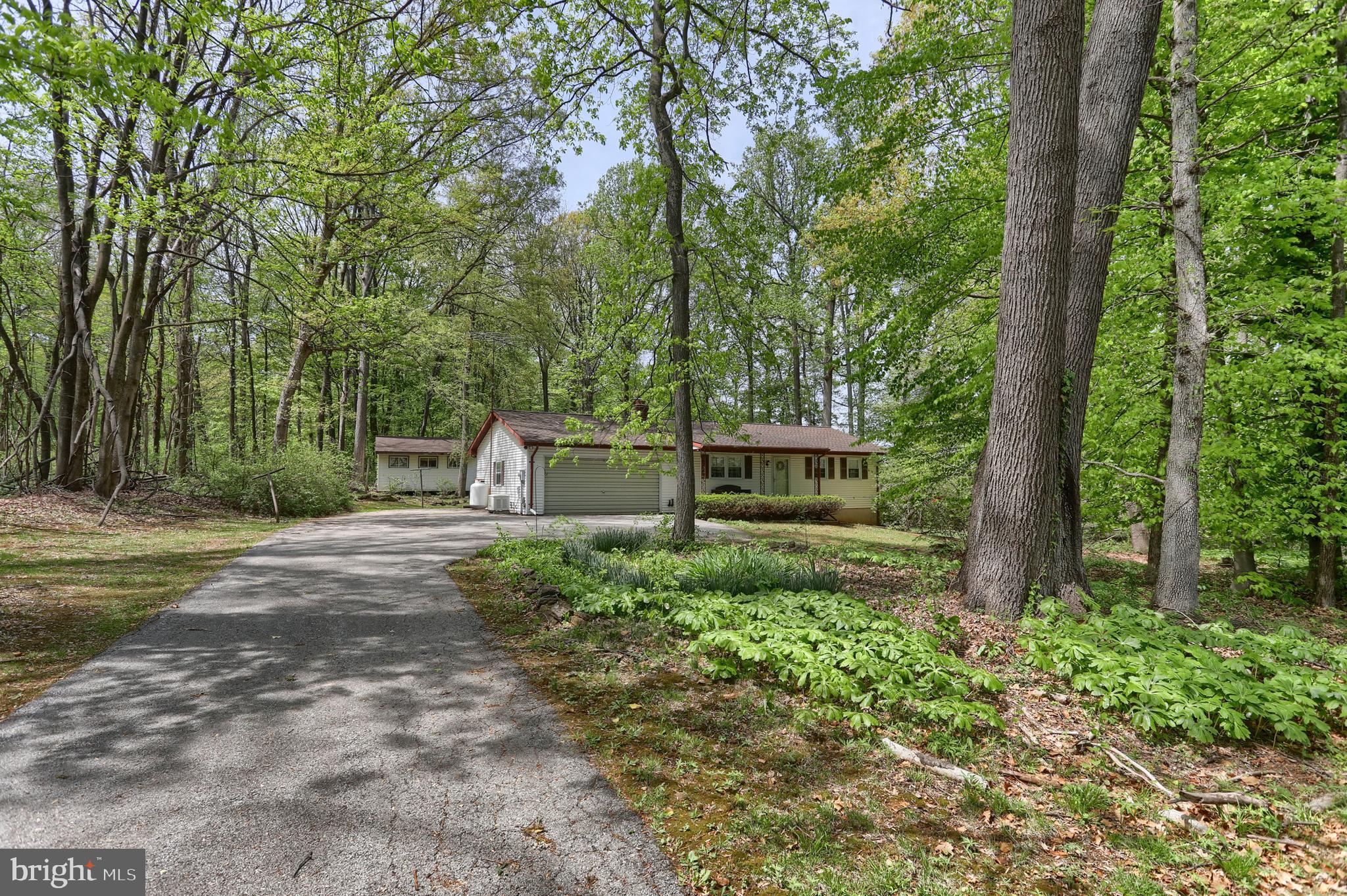 Country Haven.......Great ranch home across from Shelley Park on beautiful 1.47 private wooded lot in Northeastern SD.     Home features 1 level living with 2 beds/1 full bath with front and back porches, brick fireplace in living room, whole home generator, 2 car attached garage, large level wooded lot with 1.47 acres, separate wood shop or she shed for projects or hanging out. Easy commute to Harrisburg/York.