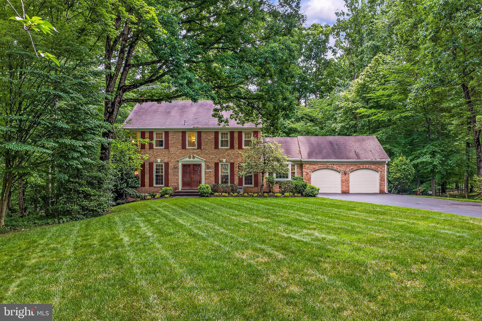 Welcome to this charming 4,000 sq ft colonial, nestled on almost half an acre on one of the most sought after streets in the highly desired Fairfax Station neighborhood.  You are greeted by a lush, flat front yard bordered with mature trees🌳.  A 2 car front load garage awaits, while a walkway leads you to the impressive double entry front door.  Inside, warm hardwoods greet you in the open foyer and meander throughout the main level, where formal living and dining rooms flank the center hall.  A bonus den/office/potential main level bedroom is neatly tucked away and is situated next to the oversized powder room on the main level.  A renovated gourmet kitchen with top of the line stainless steel appliances, quartz countertops and tons of cabinetry is the heart of the home and has plenty of space for preparation and entertaining.  An informal dining area adjoins the cozy family room where the focal point is the brick surround gas fireplace.  It is also here that you are granted access to the expansive deck beyond.  A coat closet and laundry room complete the main level.  
Upstairs you will find the primary suite with its own sitting room and plenty of closet space.  The renovated ensuite is as beautiful as it is functional, and is the perfect place to start and end your days with 2 vanities, a soaking tub, separate walk in shower and a walk in closet.
Down the hall, 3 additional bright and cheerful bedrooms, each with generous closet space share the beautifully appointed hallway bathroom complete with a new vanity, mirrors and lights.
The lower level of this home has walk-out access to the backyard and a wood burning fireplace.
Every inch of this home has been lovingly maintained and updated! Welcome home! 
🎓Oak View Elementary School and Robinson middle and High School pyramid. 
Windows - 2014, Hot water heater - 2025, Septic pumped 11/25, Carpet - 2026, paint - 2026.
🏊‍♂️Community pool (memberships available), 🎾tennis courts, neighborhood pond, and walking trails. Easy access to the Fairfax County Parkway, Route 123/Ox Road, commuter bus stop at entrance to the neighborhood, Burke Center VRE station minutes away.