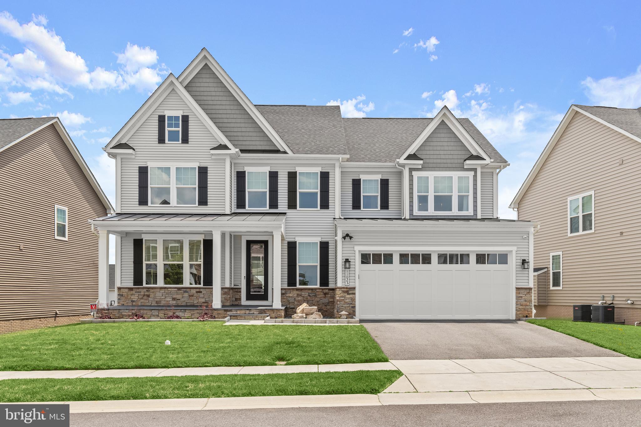 Truly exceptional NV Homes Longwood model in desirable Maple Lawn South, only five years young. This home features a top upgrade front elevation, adding two extra feet to the front bedroom, dining room, and lower-level exercise room. Pristinely maintained, it offers unparalleled top-of-the-line upgrades. A covered front porch greets you, enhanced with custom limestone slabs and an exquisite stone feature. Inside, the remarkable open floor plan spares no expense with hand-scraped hardwood flooring throughout the main and upper levels and custom window treatments, including top-down/bottom-up light filtering shades. The stunning chef-inspired kitchen highlights Quartz counters, a decorative tile backsplash, a gas cooktop, a center island, Restoration Hardware pendant lighting, double wall ovens, and a large custom Closet America walk-in pantry. The adjoining breakfast area and family room feature a custom Pella 14' stackable slider with three 4’5” glass panels and three custom light-filtering motorized shades. Relax on the screened porch, showcasing a stone gas-burning fireplace, a 55” TV, two app-controlled ceiling fans, Sonance outdoor speakers, custom lighting, and custom sunshades. There is also an open deck area with a hose bib and custom lighting. The main level includes a formal dining room, an optional fifth bedroom or office, a full bathroom with tile to the ceiling, custom frameless shower doors, and an arrival center. Upstairs, the sprawling primary suite is adorned with a custom ceiling fan, two custom Closet America walk-in closets, a tray ceiling, custom room darkening shades, and crown molding. The luxury primary bath features upgraded cabinetry and tile, a free-standing soaking tub, dual vanities, and an oversized double-head shower with tile to the ceiling. Three additional bedrooms each have a ceiling fan, room darkening custom window treatments, a walk-in closet, and all en suite baths with Delta Vero faucets and accessories. The upper level also includes a laundry room with a Whirlpool front-load washer and dryer on pedestal drawers. The phenomenal lower level features a recreation home theatre room with darkening custom window treatments, a custom bar with a mini fridge and dishwasher, an exercise room, a full bath with tile to the ceiling and a custom frameless shower door, additional storage, and walkout-level access. It includes a new Pella Narrowline slider and commercial-grade LVP flooring. The beautiful, covered patio features a dry ceiling, Techo Bloc high-end Para slab pavers, a custom Techo Bloc custom gas fire pit, two app-controlled ceiling fans, eight recessed lights on dimmers, Sonance outdoor speakers, a wireless access point, a 65” TV, a Dove Canyon hot tub, and custom landscape lighting. Additional features include an alarm system with extra smoke detectors and water leak sensors, pull-down attic stairs to the furnace, a radon system with a fan, Tech Bloc edgers with beautiful stones and boulders, and landscape lighting in the front with four pathway lights leading to the side gate. The whole yard has an app-controlled irrigation system. The custom-painted garage features Swisstrax flooring, Garage Experts slat walls, custom cabinets, and a newly installed insulated Clopay garage door with a whisper-quiet side mount motor. Upgraded solid wood stairs with direct-set metal pickets allow for a wider stairway to the 2nd floor. The mechanical room includes a new GE side-by-side fridge with a water hook-up. Generac Whole House Generator installed on a custom Techo Bloc base to match the patio. Walk to the 3 schools from your community, Fulton Elementary, Lime Kiln Middle, and Reservoir High. This home offers everything you have been searching for and so much more!