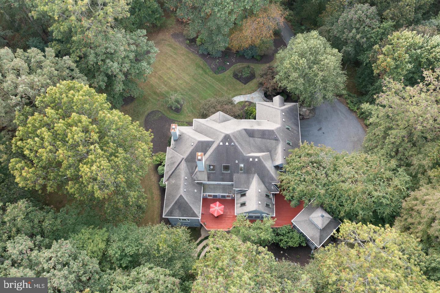 Come enjoy this exceptional, coveted Twelve Hills Community. This gorgeous 6 Bedroom, 4 Full/2 Half Bath custom built home is sits on an extremely private 3.49-acre wooded lot. From the moment you walk in, you will enter a double-height entry foyer covered with marble tiled flooring and beautiful views through the many windows and skylights! You then enter into a well designed living room that is sure to dazzle your guests! The living room boasts new carpet, exquisite built ins, and a cozy wood burning fireplace, which is surrounded by floor-to-ceiling marble! The many windows throughout this home feature stunning views of mature trees and nature all year round! The heart of this home, is its magnificent gourmet chef’s kitchen. You will find custom-built cabinetry, two large center islands, high-end appliances, warming drawer, ice maker, and much more! The Owner suite sits on the first floor, with recessed ceiling, two walk-in closets, and a newely updated Owner suite oasis bathroom. The foyer will lead you to the upper-level, overlooking the foyer and family room. Upstairs you will find three additional bedrooms. All three bedrooms are carpeted and each host a walk in closet! A bonus TV/play room upstairs is a uniquely shared space, sure to be perfect for your family! The walkout lower level offers plenty of space with a recreation area, two more bedrooms, exercise room/office space, and a wet bar for entertaining! You will find many recent updates throughout the entire home! Outside you will find a large wrap-around deck with screened gazebo, which will be perfect for entertaining or just relaxing and enjoying the gorgeous views!. The backyard has been recently updated with many hardscaping features, landscaping, twilight lighting and a stone fire-pit. Photos,Video and drone coming soon...