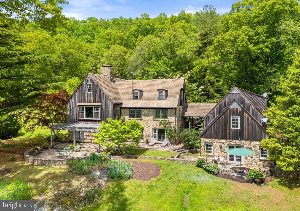 In its unique, spectacular location, Oak Ridge Farm offers extensive mountains views and privacy. The renovated stone and cedar main house on 54 acres features stunning views of the open countryside and the Cobbler Mountains, a main floor primary bedroom suite, heart of pine floors, over 35 windows, radiant stone floors, wood burning fireplaces, custom built-in bookshelves and stone terraces. There are 4 bedrooms and 4.5 baths along with a wonderful mix of formal and casual spaces. Enjoy a formal dining room, a living room with 13' ceilings, a cozy library, a family room, light-filled breakfast room and a renovated gourmet kitchen. The property includes a 2-car garage with storage above, along with a separate home office or studio with a kitchenette, full bath and a private terrace. There is a pool house with a swimming pool (as is) , an equipment shed, two fenced pastures, a building that could be turned into a small barn and a spring fed pond. There's also a farm manager's log cabin with 3 bedrooms and two baths.  Starlink internet installed at the main house. Located just over 3 miles from I-66, it's 25 minutes to Middleburg and 45 minutes to Dulles Airport. Best of all ...the farm's mountain views are protected by over 2,000 acres of neighboring land in conservation easement.