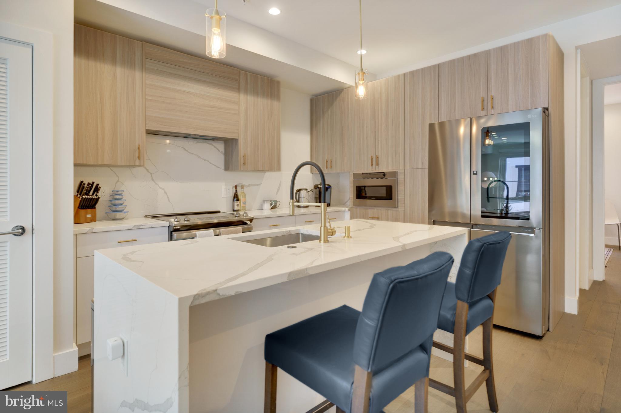 Welcome to 922 N 15th St #2!  This is an absolutely stunning newer construction unit with multiple features that make it stand out from other properties in the area! All throughout, you'll appreciate the room sizes, high ceilings, ample storage space, and luxury finishes/fixtures. Finally, a new construction home with style! The kitchen, light fixtures, and bathrooms are all modern, but the finishes were tastefully chosen for a timeless aesthetic. The layout is extremely convenient, but also allows quite a bit of flexibility. The main floor contains the open floorplan living room/dining room/kitchen, but also a full bath and full bedroom at the rear which works perfectly as a guest room, workout room, or home office. Upstairs, you'll love how spacious the hallway and bedrooms feel, taking full advantage of the 18 foot wide property. The primary suite is even more dramatic with a raised 15 ft+ ceiling and an abundance of windows, which you really have to see in person to appreciate how unique it is. This level also contains another very large bedroom (pictured with 2 beds!) and a 3RD FULL bathroom. Only to be outdone by the pilot house wet bar and two-tiered roof deck, with unobstructed skyline views. The location is also extremely convenient with WalkScore, BikeScore, and TransitScores all in the 80's - in fact, the BSL Girard Station is only about a block away... which makes any travel to Center City, Fishtown/NoLibs, Temple, or S Philly a breeze. The unit is also walking distance to Fairmount Ave shops/restaurants/nightlife, The Met, Divine Lorraine, and local favorites like Vineyards Cafe, Cambridge St Coffee, Rybread, Bar Hygge, Lorraine, & more. Unit is vacant and can be seen on short notice!