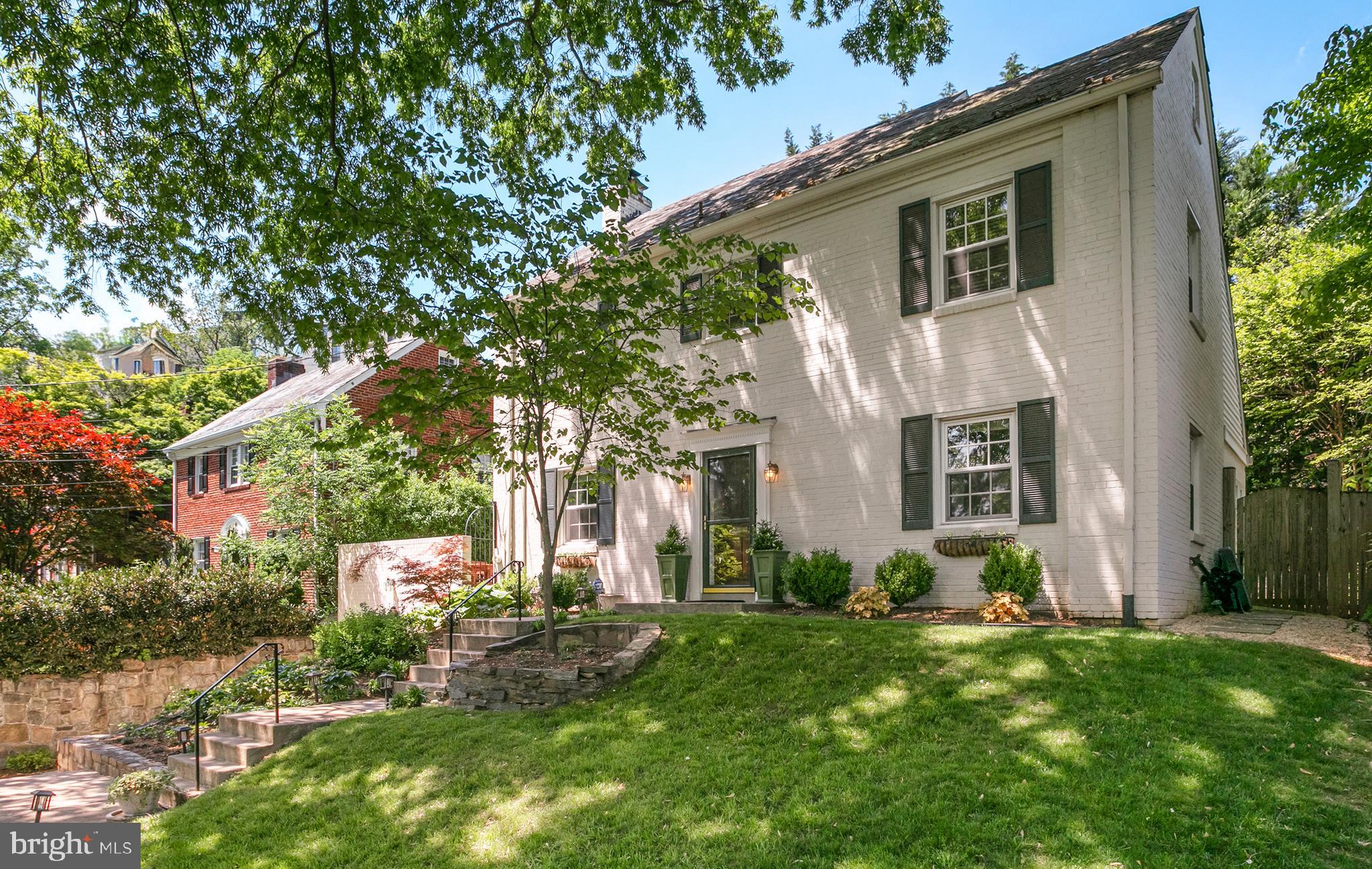 OFFERS, IF ANY, DUE TUESDAY, MAY 14TH AT 3:00PM. Lovely brick colonial in The Town of Chevy Chase near downtown Bethesda. This elegant center hall classic is anchored by original hardwood floors, crown molding, and modern lighting. Balanced by a living room with wood burning fireplace, recessed lighting, and windows on three sides. Enjoy all seasons in the breakfast room/sunroom with walls of windows overlooking the lush backyard. The kitchen features stainless steel appliances, ample cabinetry, and updated countertops. Upstairs, the primary bedroom features an en suite modern bathroom with double vanity and shower. The second and third bedrooms offer a spacious closet for plenty of storage space. The top floor is used as a 4th bedroom and office. The finished basement is the perfect family room with laundry, built-ins, a full bathroom and more storage. Enjoy the outdoors in the wonderful backyard and the newly paved concrete area above the garage is a bonus space for entertaining!  Driveway and attached garage parking complete this fabulous offering.