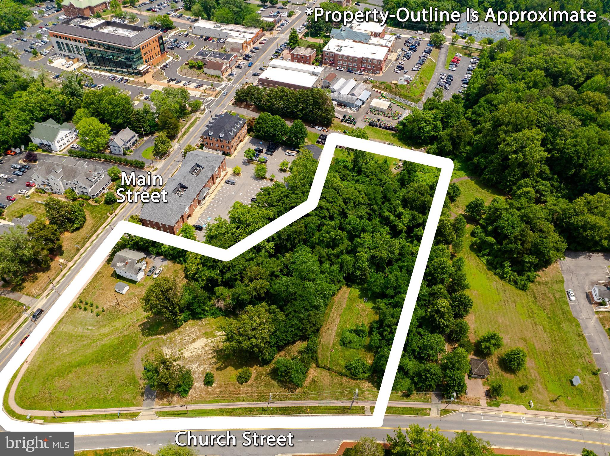 Exceptional opportunity to own three acres in the heart of the Prince Frederick Town Center.   Ideally positioned at the highly visible intersection of Main Street and Church Street, this prime commercial property is located in the center of "downtown" Prince Frederick.
Within walking distance of the Calvert County Courthouse, State and County government offices, professional businesses, retail shops, restaurants, and other community amenities, this location offers outstanding convenience and accessibility. The property's walkable setting, excellent public transportation access, and exceptional visibility make it an ideal site for a wide variety of permitted public or private commercial uses.
Listing is for 125 Main Street  and 91 Church St. They are adjoining properties with separate tax id numbers.  The two properties are only being sold together!  Please do not ask-They are NOT being sold separately. 
Existing building on 125 Main St parcel is being sold as is.  Value is in the land!
Whether you're planning professional offices, retail, mixed-use development, or another business venture, this is a rare opportunity to invest in one of Calvert County's most desirable commercial locations.
Don't miss the chance to bring your vision to life in the center of Prince Frederick.  Please reach out with any questions.
Listing agent is a member of  the selling entity.