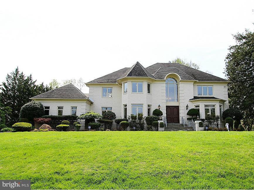 Exceptional Value! Custom Home on Picturesque 2 Acre Lot (ideal for pool & tennis), 6 BRs, 6.5 BAs. Amenities include 2-Story Marble Foyer w/Curved Staircase, 2-Story Great Room w/ Marble Fireplace, Luxurious Master Suite, Walk-Out LL, Deck, Patio, Circular Driveway, 3-Car Gar, 3-zone HVAC, Gas & Public Water/Sewer. Only 1.5 mi to the Village & 9.5 mi to Washington DC.