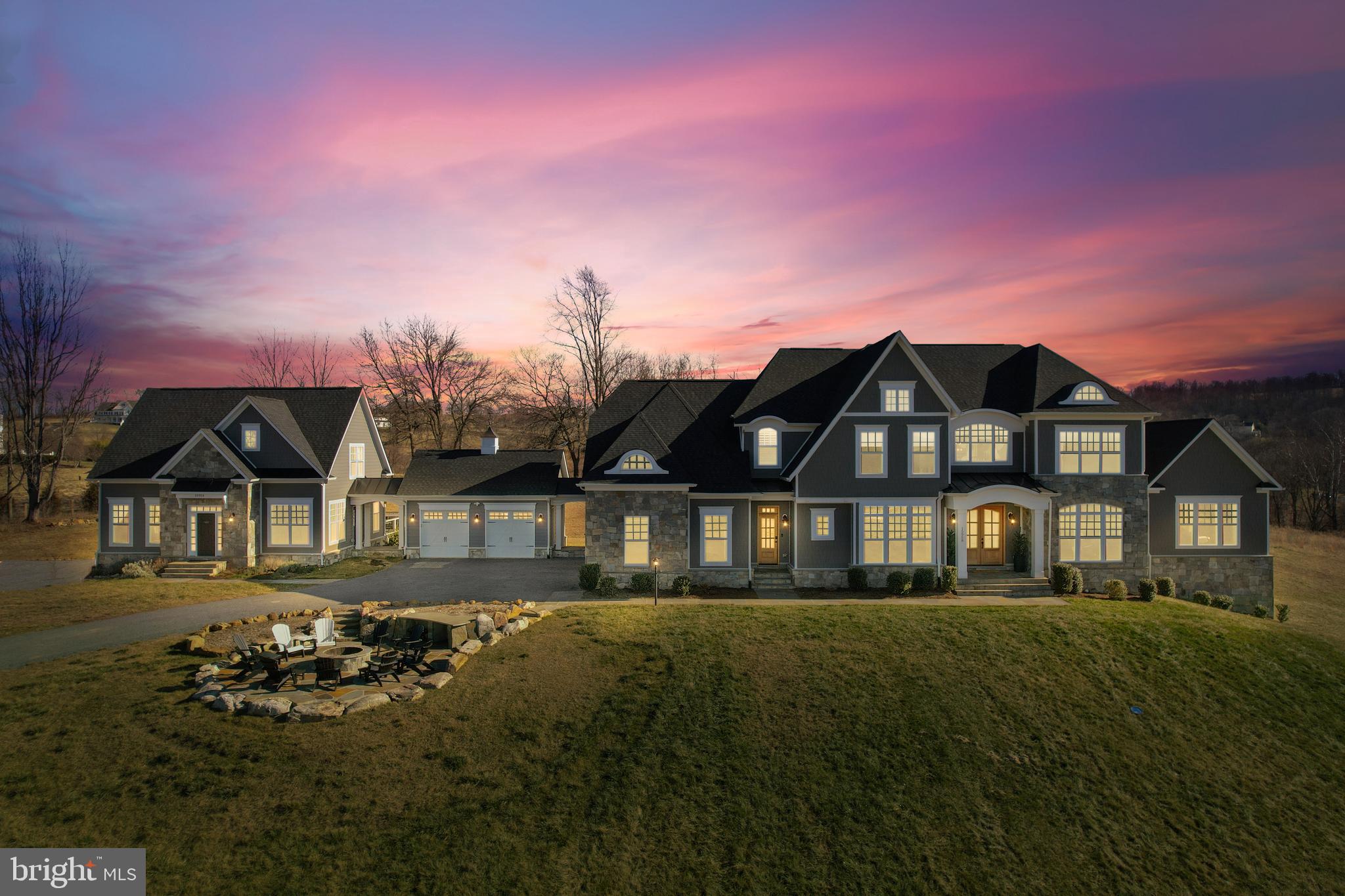 Welcome to an unparalleled oasis of multi-generational luxury living on over 14 acres of historic Waterford land. The main house, featuring 5 bedrooms and 6.5 baths, is complemented by a 2-bedroom/2.5-bath guest house, all free from the constraints of an HOA. Meticulous design graces each room, from the refined dining area to the tranquil piano room, enriched by custom built-ins, crown molding, and a gourmet kitchen. Versatile spaces for relaxation, entertainment, and focused work abound in the family room, living room, chess area, and office. The primary suite offers a secluded retreat, complete with a private deck and hot tub.
.
Step outdoors to expansive decks on both residences, offering sweeping panoramic views. A front patio with a fire pit creates an enchanting setting for gatherings under the starlit sky. Additional exterior features include a charming chicken coop and a meticulously maintained garden, featuring fencing, water lines, and storage.
.
The guest house, with 2 bedrooms and 2.5 baths, serves as a private haven for guests or extended family. Perched atop the hill, the home affords breathtaking views of the Blue Ridge Mountains and unmatched sunsets. Nestled within Waterford's historic charm, this property beckons you to embrace a lifestyle of modern luxuries on hallowed ground. Experience estate living on this expansive property, where countless upgrades and meticulous attention to detail fashion an unparalleled retreat in the beautiful Waterford, Virginia. Situated on the Route 7 side of Waterford, this property offers the best of both worlds—country living with convenient access to the amenities of Leesburg.