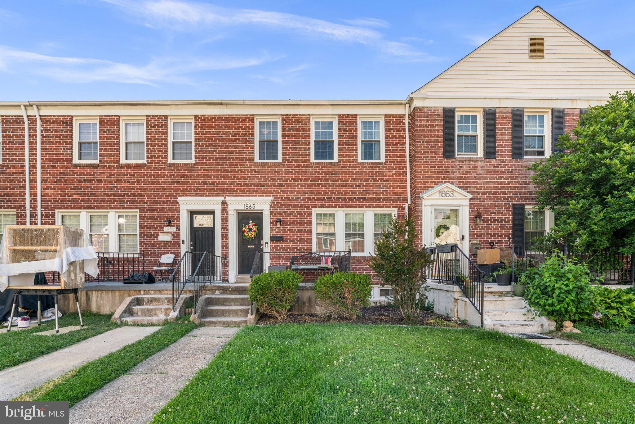 Welcome to this well-maintained all-brick 3-bedroom townhome offering timeless charm, versatile living spaces, and a convenient location. Gorgeous hardwood floors flow throughout the main and upper levels, creating a warm and inviting atmosphere.


The pretty white kitchen features granite countertops and stainless steel appliances, including a gas range with microwave range hood. A door from the kitchen provides easy access to the rear deck and backyard, making outdoor dining and entertaining a breeze.


Upstairs, you'll find a full hallway bathroom, a charming built-in bookshelf, and three comfortable bedrooms. The finished lower level expands the living space with a spacious second family room, a convenient half bath, and an additional room ideal for a home office, fitness area, hobby room, or guest space. A dedicated laundry room and direct access to the backyard add to the home's functionality.


Outside, enjoy the backyard space perfect for relaxing, gardening, or entertaining. Conveniently located near shopping, dining, and major commuter routes, this home offers easy access to everything you need while providing comfortable living in a classic all-brick setting.