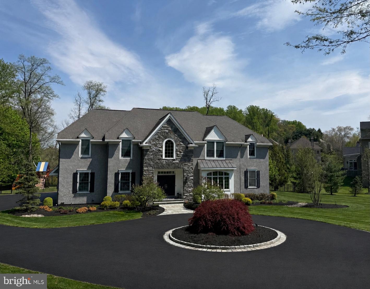 Welcome to this exceptional 4-bedroom, 6-bathroom luxury residence in the highly sought-after Worthing community. Thoughtfully designed with impeccable craftsmanship and sophisticated finishes throughout, this stunning home offers elegant living spaces, outstanding amenities, and effortless indoor-outdoor living.
A dramatic two-story foyer sets the tone, flanked by elegant formal living and dining rooms and a private home office with custom built-in cabinetry. At the heart of the home is a spectacular gourmet kitchen featuring light cabinetry, quartz countertops, premium appliances including a Sub-Zero refrigerator and built-in Miele coffee system, and an oversized island perfect for gathering. The kitchen flows seamlessly into the sunny breakfast room and spacious family room, creating an ideal setting for both everyday living and entertaining. A convenient powder room and attached three-car garage complete the main level. Upstairs, all four generously sized bedrooms feature beautifully appointed en-suite bathrooms, providing comfort and privacy for family and guests alike. The luxurious primary suite is a true retreat, offering surround sound, a spa-inspired bathroom with an oversized walk-in shower, freestanding soaking tub, dual vanities, and exquisite finishes. The custom walk-in closet is a showpiece with a center island and elegant backlit cabinetry. A second-floor laundry room with two washers and two dryers adds exceptional convenience.
The finished lower level was designed for recreation and relaxation, featuring an expansive media and lounge area, a gaming room, two custom built-in bunk bed alcoves perfect for sleepovers, a spacious home gym, and a full bathroom. Step outside to your own private resort-style backyard. Designed for unforgettable entertaining, the outdoor oasis showcases a stunning newer pool, a covered outdoor kitchen, bar, and ample space for dining and relaxing. Ideally located just minutes from vibrant downtown Wayne, premier golf at Aronimink Golf Club, and The Episcopal Academy, this extraordinary home offers the perfect combination of luxury, comfort, and convenience.
