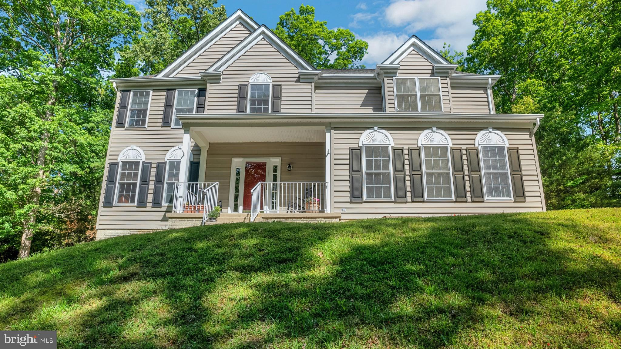 ***NO MORE SHOWINGS*** Sellers Reviewing offers and ratifying  Wow! Over 2 acres in sought-after "Cove Point Woods" neighborhood, beautiful and move-in-ready.  Tucked into its own private nook within the neighborhood, this stately colonial sits overlooking  large grassy lawn and beautiful mature trees.  The private drive means that it sits well off the beaten path: no thru traffic and lots of room to stretch out and enjoy the outdoors!  Sellers are the original  owners, and have  meticulously maintained, updated, and cared for their home through the years.   The beautiful chef's kitchen, complete with granite counters, stainless appliances and farmhouse sink  is designed for easy entertaining and family meals. With both an eat-in/breakfast area and a formal dining area, a formal (front) living room, and a large den, there's plenty of space to stretch out!  Upstairs, the primary bedroom features beautiful high ceilings, 2 walk-in closets, and an en suite bathroom with spa-like custom finishings. Three additional bedrooms upstairs, all with ample closet space, are spread out nicely, down the hallway overlooking the two story foyer.   All of this plus a beautiful front porch area to sit and sip coffee while enjoying the quiet, and a custom back deck perfect for entertaining or a quiet evening outdoors.  The walk-out level unfinished basement is ready for you to design and make your own, and features rough in for an additional full bathroom.    This one has it all, and then some - and is ready to move right in.  Schedule to see it before it's SOLD!