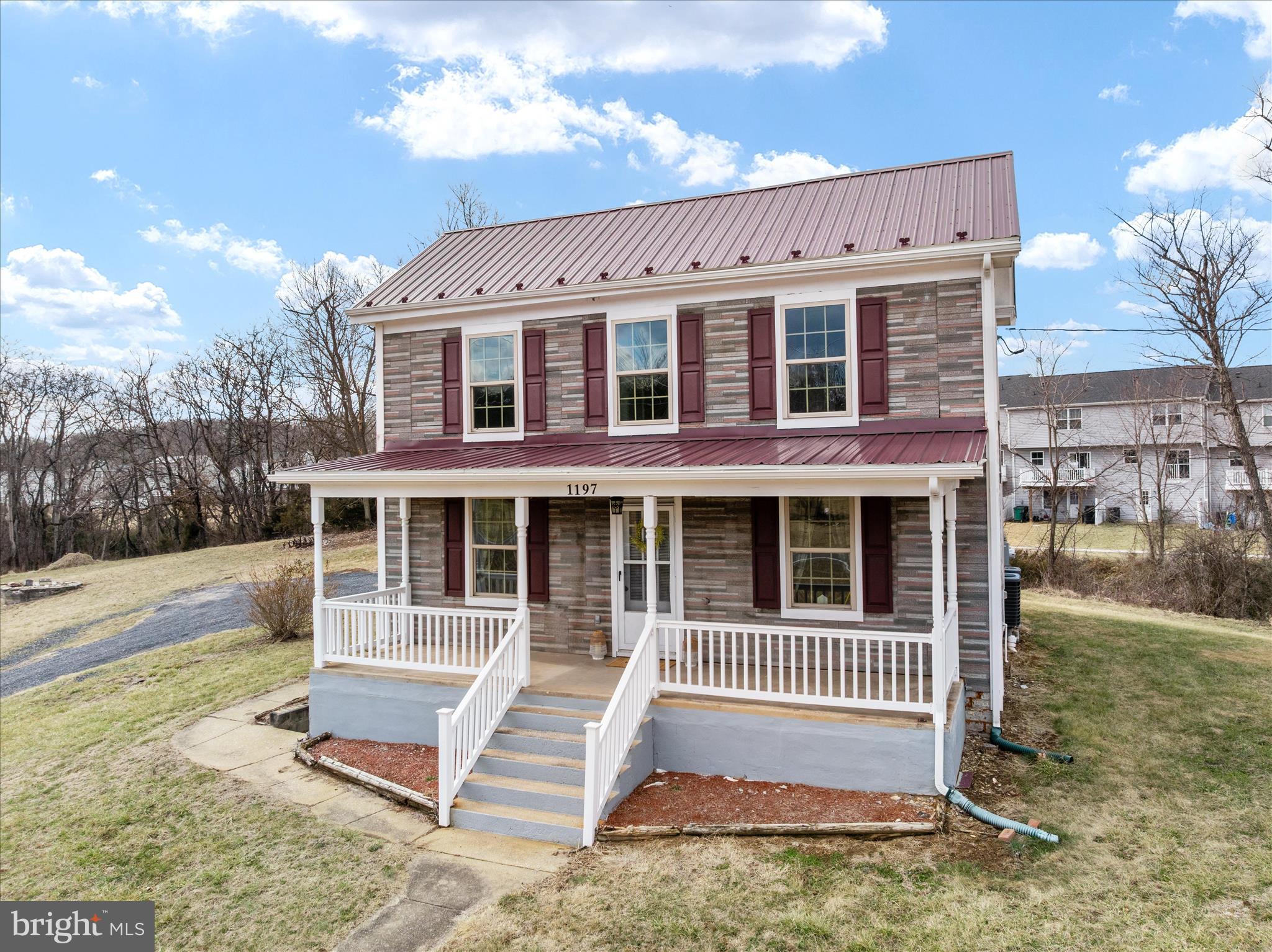 See video & photos 
This is not your cookie-cutter new build — this home offers character you simply cannot replicate!

Welcome to this truly distinctive early 1900s folk-style home in the Town of Strasburg, VA — a property that beautifully blends timeless character with modern updates. Situated along Rt. 55 with convenient access to I-81 and downtown amenities, this home offers both accessibility and the ability to relax on the covered front porch while enjoying scenic mountain views.

Remodeled in late 2024, the majority of the home was taken down to the studs and rebuilt, with improvements throughout. Updates include 200-amp electrical service, new plumbing, new insulation, new windows, two brand-new heat pumps, and a new metal roof. The exterior preserves its historic charm with a mix of asphalt shingles and vinyl siding, maintaining the character of the original folk-home design.

Inside, you’ll find over 1,400 finished square feet filled with warmth and craftsmanship. Some original hardwood floors remain on the main level, complemented by deep windowsills, chair rail, and wainscoting accents that highlight the home’s historic personality.

The spacious kitchen-and-dining combo features striking white-pine tongue-and-groove ceilings, creating a rustic yet refined gathering space. A convenient side-covered entrance leads directly into the kitchen, and the main-level laundry adds everyday practicality. The family room areas center around an original brick chimney, giving the space heart and architectural interest.

A flexible main-level bedroom offers versatility — ideal as a guest room, formal living room, dining room, or office.  And conveniently located close to a full bath with a walk-in shower. 

Upstairs, a classic wooden banister leads to three additional rooms, including two guest bedrooms and a third room (without a closet) perfect for an office, craft room, or playroom, or an optional 4th bedroom. A spacious full bath with tub/shower combo serves the upper level. Carpeted stairs and upper level add comfort, while the floored attic provides additional storage space. A cellar offers even more storage flexibility.

The generous .99-acre lot backs to trees and features expansive front, side, and rear yards. Outdoor highlights include:

Covered front porch with mountain views

Gravel driveway with a large parking area and room to turn around

Concrete pad (ideal for a future outbuilding, patio, or basketball area)

Rear shed for storage

Space to potentially add a garage

Additional acreage available for purchase if desired

The septic system was repaired in 2026, offering added peace of mind. Town water and sewer hookup may also be an option.

If you’re looking for charm, space, mountain views, and convenience in Strasburg, this one is a must-see.