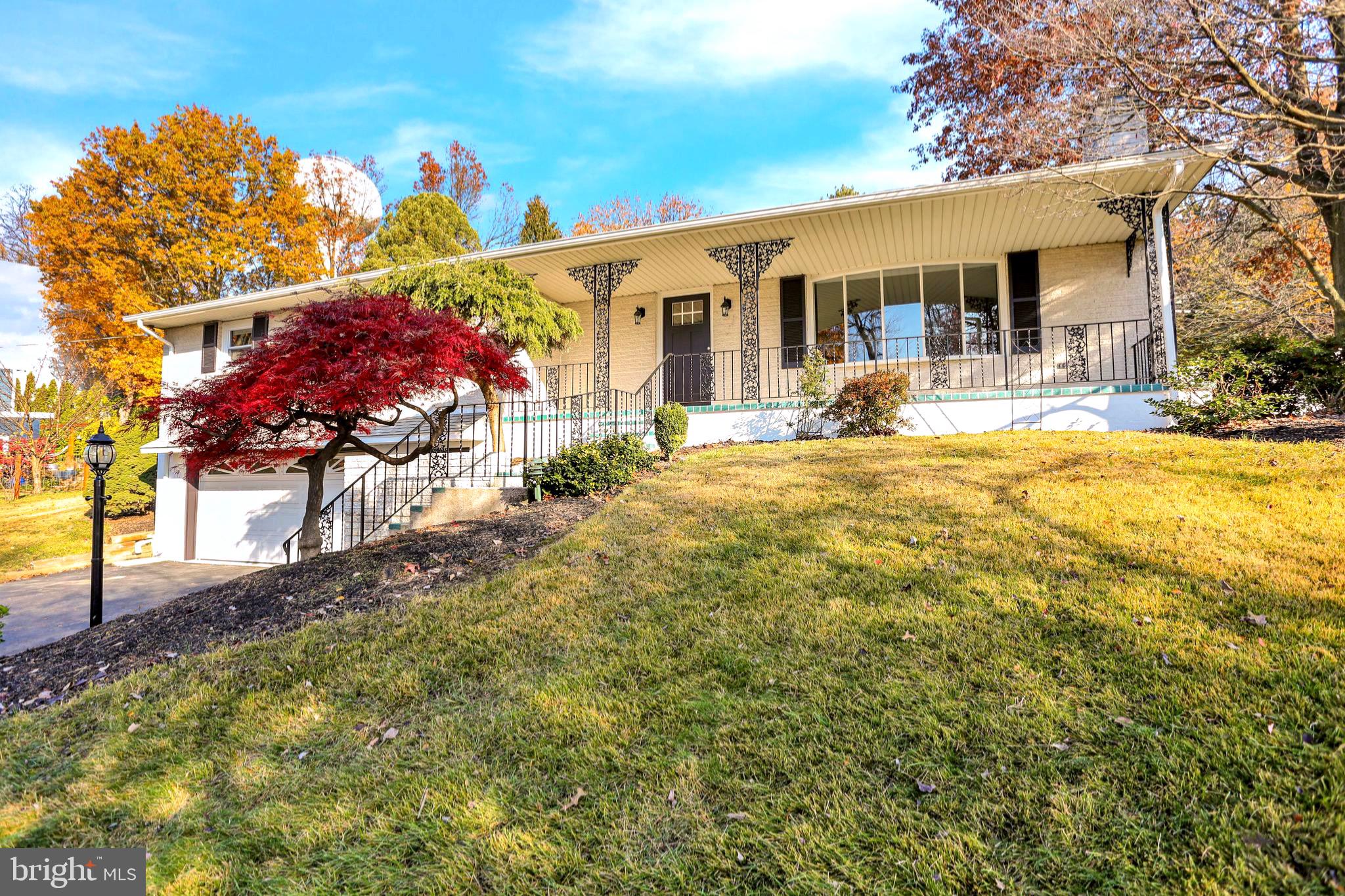 Step into the welcoming embrace of 89 Wyomissing Hills Blvd, a charming four-bedroom brick ranch nestled in the heart of Wyomissing Hills. This home offers a comfortable and inviting living space with a range of desirable features. As you enter, you'll be greeted by a spacious living room adorned with a cozy fireplace and a large picture window, allowing natural light to fill the room. This creates a warm and welcoming atmosphere, perfect for relaxing or entertaining guests. The beautiful, bright white kitchen is a standout feature of the home, boasting new stainless steel appliances, an island for additional workspace, and a stylish tile backsplash. This well-appointed kitchen provides ample storage and a delightful space for preparing meals and gathering with loved ones. The home offers four nice-sized bedrooms, including a master suite complete with a full bath for added privacy and convenience. Hardwood floors adorn all the bedrooms, adding a touch of elegance and easy maintenance. The finished basement adds valuable additional living space to the home, providing a spacious family room where you can unwind and enjoy leisure time. Additionally, there is an office area, perfect for those who work from home or need a dedicated space for studying, half bath and a laundry room. A major highlight of this exceptional home is the inground pool within the fenced in rear yard promising endless hours of relaxation and recreation. Inquire for more details and take the first step toward making this your next dream home.