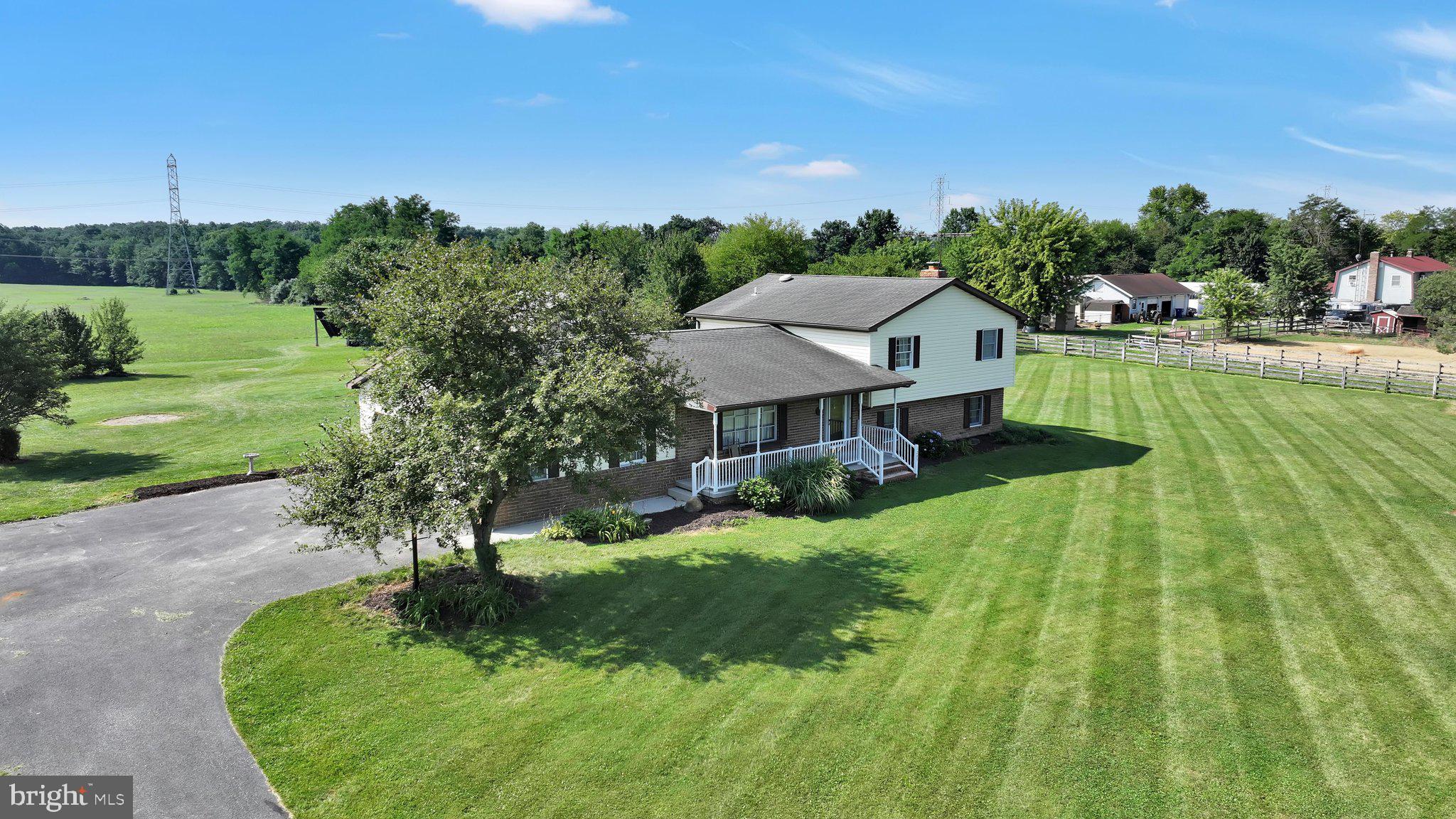 ***Showings Commence Friday 7/24/26***Welcome to your dream countryside oasis nestled on 5.44 flat, usable acres in scenic Straban Township, located within the highly desirable Gettysburg School District and with easy access to major highways for your commute and shopping needs. This beautifully updated circa 1985 split-level home perfectly blends rural tranquility with modern, eco-friendly efficiency.  Extensively remodeled in 2008, the property offers 2,406 square feet of bright, inviting living space designed for both comfortable daily living and effortless entertaining.
Step inside to find a spacious 18 x 13 main-floor living room that flows seamlessly into the dining area and a well-appointed kitchen, which comes complete with all stainless steel appliances included. The true showstopper of this home is the massive, remodeled 27 x 16 sunroom. Bathed in natural light, this incredible space features durable ceramic tile flooring, brand-new windows, fresh drywall, and a stack pipe ready for your cozy pellet stove.
The sunroom connects directly to the lower-level recreation room, anchored by a classic wood-burning fireplace that is ideal for movie nights or winter gatherings plus allows for passive heat to the upper level through vents. Lower level also hosts laundry area with half bath. When it is time to unwind, the home offers a peaceful retreat in the expansive 17 x 15 primary bedroom suite, along with 2 additional bedrooms and two and a half baths to comfortably accommodate family and guests. For seasonal storage and utilitarian needs, an additional crawlspace basement provides plenty of extra room out of sight plus crawl space storage above the attached 2 car garage.
Beyond the main home, the property is an outdoor enthusiast's or hobbyist’s dream. In addition to the attached two-car garage, the acreage boasts a handy storage shed and a substantial pole barn that received a brand-new roof in 2021. You can also say goodbye to high utility costs thanks to the seller-owned solar panels that yield an amazingly low electric bill, with the full electric history available upon request. Modern comforts like central air conditioning, a water softener, and a generator hookup offer ultimate peace of mind.
Professional photography is coming soon, but you do not have to wait to secure your piece of Adams County paradise. Sellers will consider including a Home Warranty with acceptable offer. Mark your calendar for the upcoming open house on July 25th from 12:00-2:00PM, or pre-schedule your private showing now to beat the crowd. Call today for more details and to take the first step toward making this exceptional countryside property your own. To ensure all interested parties have a fair opportunity, the seller requests the property remain on the open market for a minimum of four days before offers are reviewed. Decisions and responses to offers will be made no sooner than Tuesday, July 28, 2026