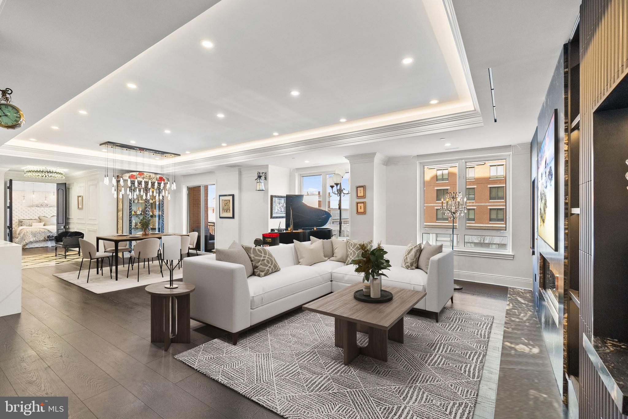 Luxury living without the upkeep in Annapolis! This extraordinary residence combines two units into one expansive, stunning home in Annapolis Towne Centre offering over 3,400 square feet of impeccably finished living space on one level. Completely gutted to the studs and reimagined, this one-of-a-kind home places you right in the center of it all—and only minutes from Downtown Annapolis—yet feels like a private retreat from the world.

Designed for both grand entertaining and everyday comfort, the custom gourmet kitchen anchors the home and flows seamlessly into inviting living spaces. Sound-proof, glass-tempered doors allow rooms to transition effortlessly from open and connected to intimate and private. Thoughtful details include hidden, built-in Sonos speakers, exquisite moldings, tray ceilings, modern lighting, and a stunning blend of wood and marble flooring throughout.

Wine enthusiasts will appreciate the climate-controlled wine room, while the primary suite is a true sanctuary, featuring a glamorous dressing room, multiple custom closets with secret storage, and a spa-like ensuite bath with hand-cut mosaic tile flooring and an oversized walk-in shower with glass door linen closet. 

Featuring a fully integrated Lutron smart home system, this residence offers effortless control of lighting, motorized shades, audio, temperature, and security access.  Additional highlights include three additional bedrooms, two additional full baths, four garage parking spaces and two storage units. 

Residents enjoy world-class amenities including concierge service, fitness center, yoga studio, library, meeting rooms, elegant lounge spaces, and a spectacular rooftop pool—delivering a lifestyle that is as effortless as it is refined. 

Towne Centre has become the new heart of Annapolis — a vibrant destination where you’ll find everything you need, from grocery shopping and a premier fitness center to exceptional dining and upscale retail.