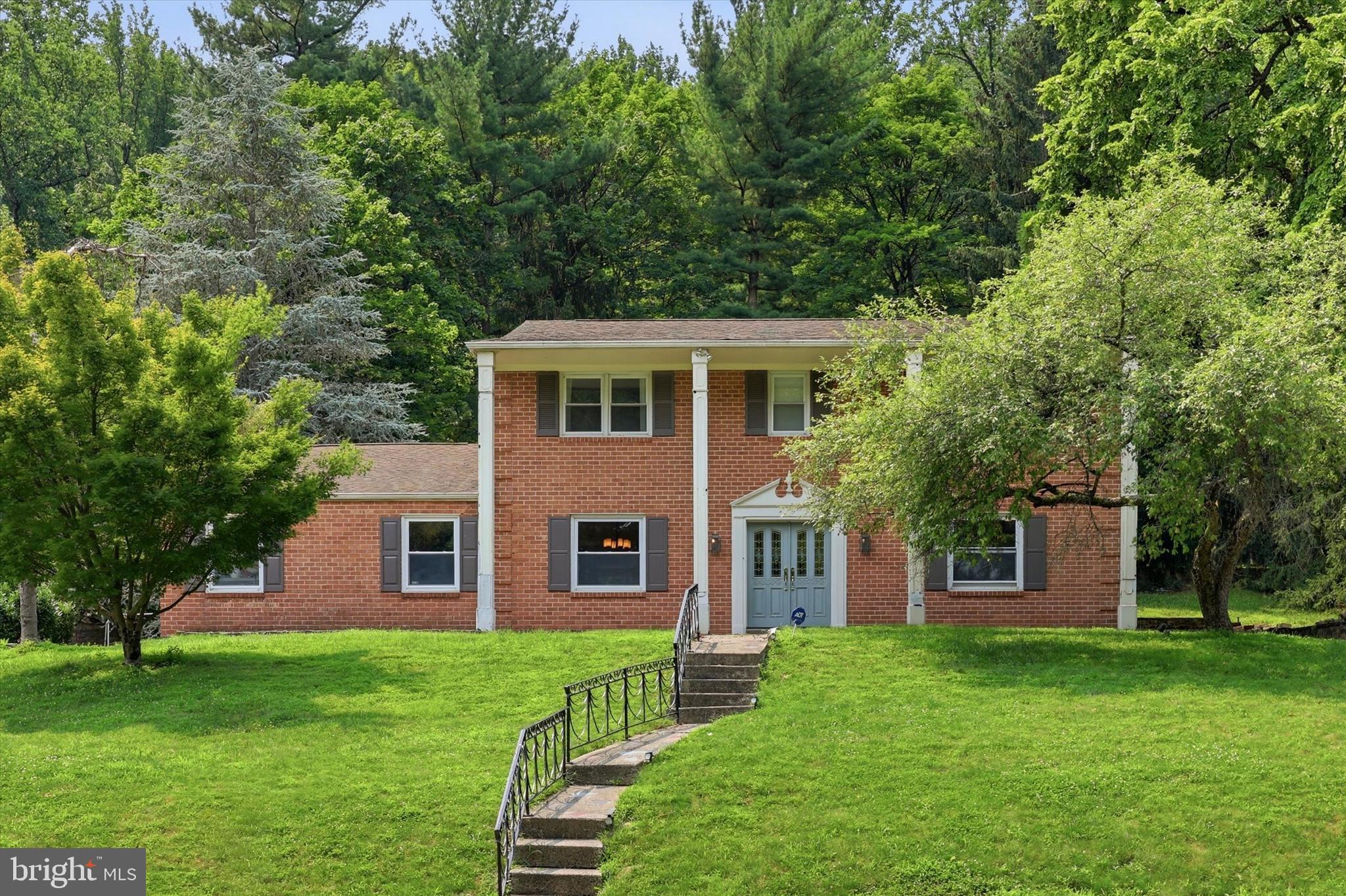 Perfectly positioned on a picturesque cul-de-sac lot in desirable Andorra Woods with magnificent mature landscaping, this classic brick residence offers timeless curb appeal with its elegant pillared entry and inviting presence.

This home offers a generous living spaces, and modern kitchen and bathrooms. The home has been loved by its family and provides an exceptional opportunity to customize a quality-built residence in a sought-after location.

Inside, you’ll find spacious and comfortable living areas filled with warmth and character. Highlights include gleaming hardwood floors, a welcoming family room with fireplace, generously sized bedrooms, and an updated large eat-in kitchen featuring a tiled backsplash, cork flooring, and plenty of space for gathering and entertaining.

Step outside and enjoy the beautiful backyard retreat surrounded by mature landscaping, complete with a paver patio and gas barbecue hookup — the perfect setting for relaxing, gardening, or entertaining.

Additional features include a two-car side-entry garage, remodeled foyer, upgraded and spacious mud and laundry room with abundant cabinetry and storage, plus easy access to public transportation and Routes 76 and 476.

A rare opportunity to own a home with space, character, location, and incredible potential. Bring your ideas and make this special property your own.