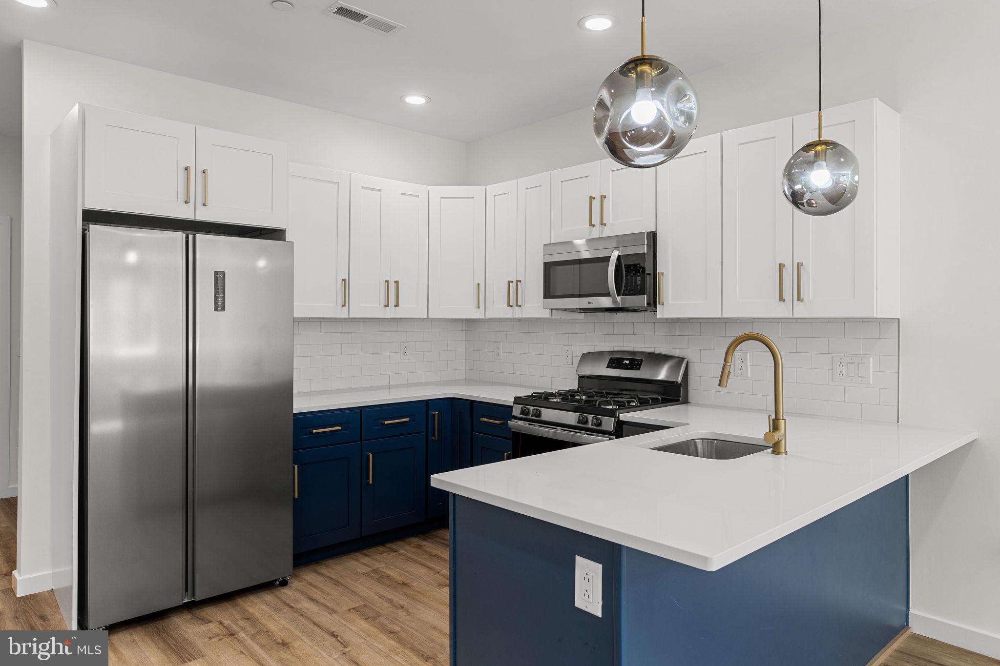 Don't miss the incredible value in this recent new construction home featuring roof deck and tax abatement UNDER $350,000! Enter to a spacious main level with living room and open kitchen, white shaker cabinets and abundant countertop and storage space. This unique floor plan is well-suited for privacy with a bedroom and full bath on three levels. For example, the second floor features a laundry room, full bath and only one spacious bedroom for privacy and additional space. On the third floor, a primary bedroom suite fills the entire level with a walk-in closet, walk-in shower, separate tub, double vanity sink, and another spacious bedroom. In the basement, a third bedroom and third full bathroom could easily be converted to work from home space or home gym. Don't miss the roof deck or rear patio perfect for outdoor cooking. Approximately 5 years remaining on a full, 10 year property tax abatement. Convenient to SEPTA transit, Center City, and Fairmount Park. Schedule your private showing today!