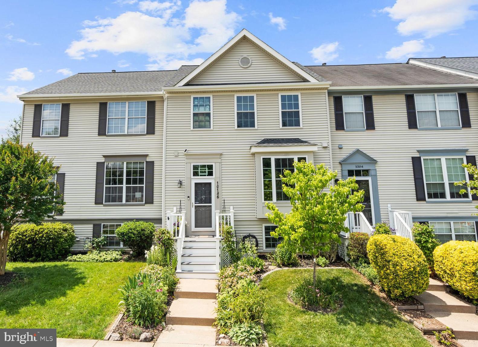 ***Sellers have an Assumable VA Loan that they are allowing Veterans and Civilians to apply to assume!  The assumable VA loan has an interest rate of 2.25% with a balance of $265,000 from Pennymac with a current monthly mortgage is $1,826.32.  ***
Welcome Home to this completely renovated 4 bedroom/3.5 bath town home with high-end finishes in the sought after amenity rich and conveniently located Wellington Community! Literally nothing to do but move in; the current owners have done it all inside and out!  It is immaculately maintained and oh so nice!  Be prepared to be WOWED from start to finish around every corner when you tour this beautiful home!  The soaring entry foyer welcomes you with board and batten trim and thoughtful storage areas with slate tile flooring and beautiful modern entry lighting.  The main level has gorgeous hickory hardwood floors throughout with added custom trim, designer paint and added recess lighting in several areas of the home.  All lighting has been replaced to set the mood to this sleek modern home. As you enter the home you will find a huge thoughtfully renovated chef’s kitchen with stacked stone walls and backsplash, high end stainless steel appliances- gas Thor Stove and stainless hood, and finished off with a stainless steel Kenmore Elite appliance package, custom kitchen cabinetry with granite counter tops, custom built in shelving and bench around the large picture window with ample storage throughout! Main level is open concept with large cut out kitchen window that opens to the dining and living areas.  There is space for a large dining table under the upgraded modern pendant light fixture that blends well into the main level living area that has a wall mount for the TV, mounted storage squares, and speaker system that will all convey.  All doors and windows have been replaced and upgraded with custom door, window, wall and baseboard trim and solid wood 5 panel doors throughout! The upper level and main level boast hardwood floors, generous sized bedrooms and all bathrooms completely renovated.  The primary suite has a walk in closet, and slate tiled bathroom floor and shower tile, with live edge custom wood sink vanity with stone bowl.  The hall bathroom upstairs and lower-level full bathroom have both been renovated with all new tile, vanities, toilets and fixtures! Lower level has a large recreation room, full bathroom, 4th bedroom utility and laundry room with stackable washer and dryer.  Outdoors you will find new composite Trex deck, sun setter awning, new fencing and private yard to enjoy. All systems have been replaced in the last few years including HVAC, hot water heater, roof, gutters, siding, low maintenance PVC trim, and new PVC and composite deck and stairs leading to the front door. This home is centrally located in the heart of Manassas, close to grocery stores, restaurants, gyms, parks, trails, and less than 2 miles from the VRE, minutes from Historic Downtown Manassas, Close to Route 234, I 66, and 28.  The home feeds to the new state of the art elementary school opening fall of 2026 - The Jennie Dean Elementary School. When visiting please park in spots 11A and 11B or street parking.  **Seller may need a 2 week to 30-day rentback. Please inquire with listing agents.