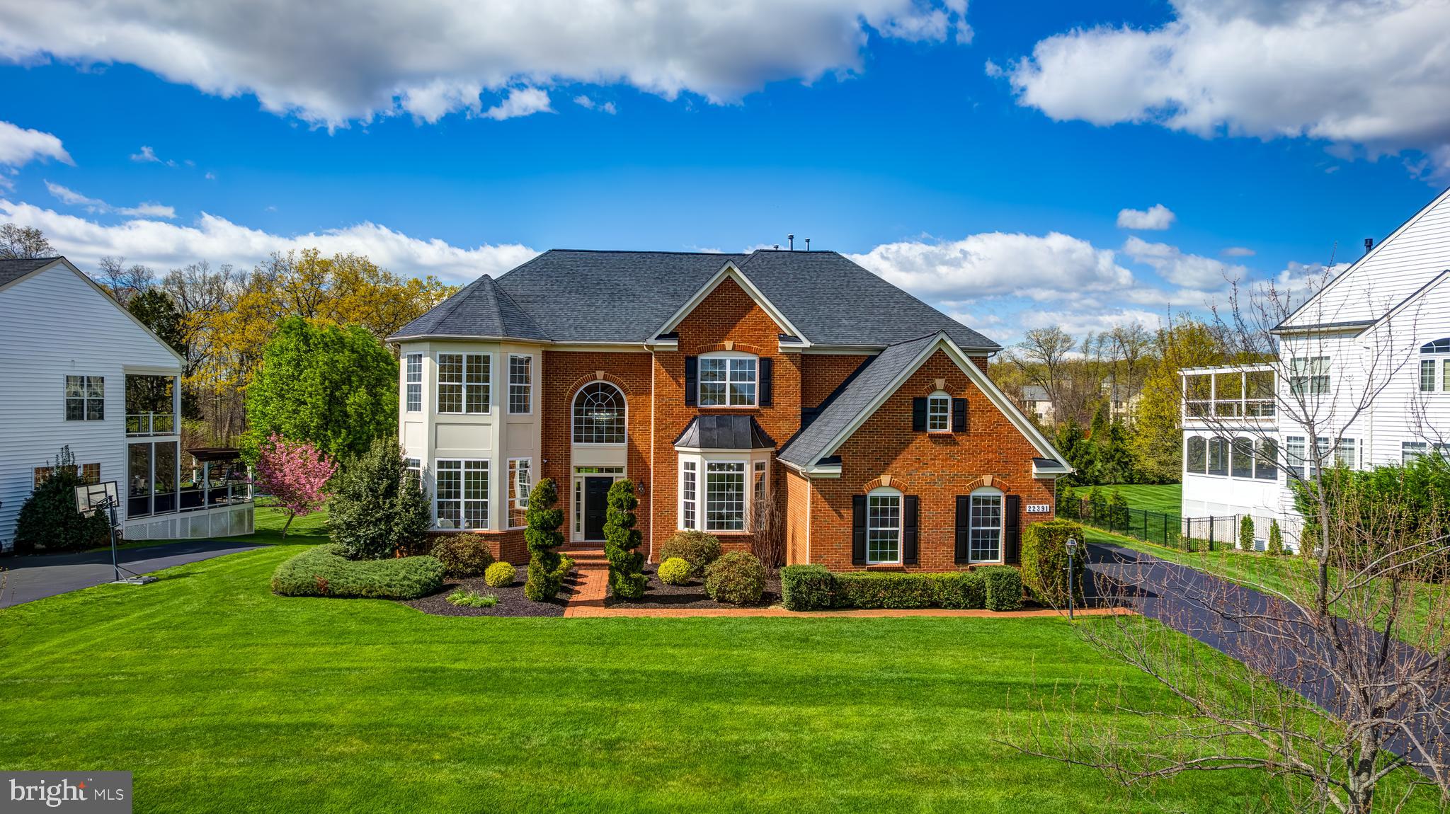 Exceptional Estate Living in the Heart of Ashburn! Nestled on a sprawling 0.65-acre lot in one of Loudoun County's most desirable neighborhoods, this spectacular estate home offers an impressive combination of space, style, and privacy. With no homes directly behind and lush trees providing a serene natural backdrop, the setting is as peaceful as it is private. Inside, enjoy over 7,000 square feet of finished living space thoughtfully designed for comfort and flow. 

The open-concept main level is anchored by an exceptional gourmet kitchen featuring crisp white shaker cabinetry, upgraded quartz countertops, and top-tier appliances—thoughtfully designed to enhance both everyday living and effortless entertaining. Adjacent to the kitchen, the light-filled morning room offers the perfect space to gather and unwind, with scenic views of the expansive backyard and direct access to the rear deck. Upon entering the home, you’re greeted by a grand two-story foyer and a dramatic curved staircase that sets an elegant tone. The main level also includes a formal living room, a private home office behind glass French doors, a cozy family room with a gas fireplace, and a formal dining room ideal for hosting special occasions. A secondary staircase located at the rear of the home provides convenient access to the upper-level bedrooms.

Upstairs, five generously sized bedrooms and four full bathrooms provide comfort and flexibility for every lifestyle. The luxurious owner’s suite serves as a true private retreat, complete with a serene sitting area, spa-inspired bath, and dual custom walk-in closets. Two of the secondary bedrooms are connected by a stylish Jack and Jill bath, while the remaining two enjoy the convenience of their own private en-suite bathrooms. Each room is filled with natural light and offers abundant storage, enhancing the open and welcoming atmosphere of the upper level.

The beautifully finished lower level offers incredible versatility, whether you're hosting guests, working from home, or simply unwinding. This expansive space includes a large open recreation room, a cozy seating area ideal for movie nights, a dedicated home gym, and a well-organized storage room with built-in shelving. A stunning custom wet bar adds a touch of luxury, perfect for entertaining, and a full bathroom enhances convenience. Walk-up access to the backyard seamlessly extends the living space outdoors.

Enhanced by upgraded internet wiring throughout, this home easily supports work-from-home needs and streaming for the whole household. Enjoy the best of outdoor living with a huge deck, a large, private yard, and plenty of room for guests and gatherings. The quiet cul-de-sac location offers a calm, community feel, along with ample parking for residents and visitors alike. Zoned for sought-after Loudoun County schools and ideally located just about a mile from the Metro, this home checks every box for luxury, convenience, and quality of life. A true gem in a prime location—this is the one you’ve been waiting for!!