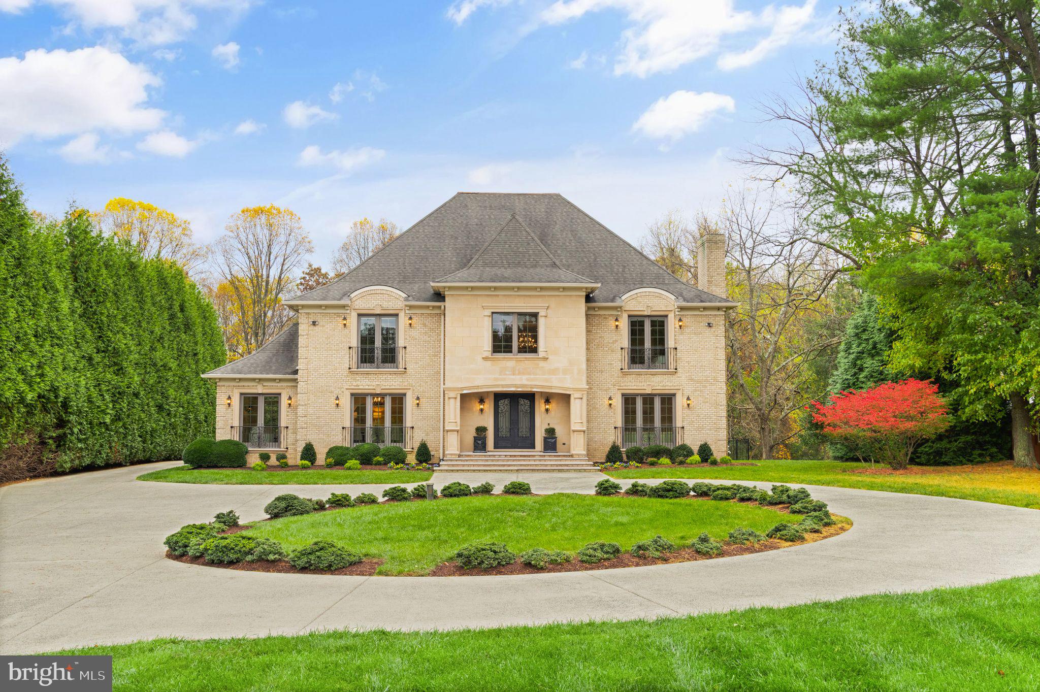 A dream lifestyle awaits at 1105 Towlston Road.  This breathtaking 6 bedroom, 10 bathroom estate home boasts nearly 12,000 square feet with fine finishes, set on a lush two-acres with a rich array of amenities.

Enter the property through its grand gate and make your way to the circular driveway that sets off the home’s spectacular façade.  Step inside and be awed by the grand foyer with soaring ceilings and elegant curved staircase.  To the right is the formal living room, and to the left is the elegant dining room, which has an extra seating area for entertaining.

The heart of the home is the kitchen, which is equipped with high end appliances, granite countertops, an oversized island with built-in sink, wet bar with third sink and built in wine refrigerator, breakfast space, and built in desk area.  Delight as you look out the wall of windows the line the kitchen with a view of the beautiful green giant evergreens that line the driveway.  Attached to the kitchen is the catering kitchen, which is outfitted with ample pantry space, a second stove and full-size refrigerator.

Set beside the kitchen is the welcoming family room, which features a fireplace, built-in bookshelves and rear access through elegant French doors to the hardscape patio, resort style pool, outdoor shower and landscaped yard.

Just off the living room is the study with walls of windows and impressive millwork, allowing you to enjoy the lush grounds while working from home.  Two powder rooms, and a guest bedroom with ensuite bath complete the first floor.

The second floor of the home features five bedrooms, each with their own en-suite bathrooms and large walk-in closets.  The primary suite is a luxurious retreat, boasting grand spaces, a wet bar with wine refrigerator, a separate sitting area with fireplace and built-ins, a Juliet balcony, and a massive spa like bath.  The bathroom’s oversized shower, large soaking tub, ample counter space and storage, along with its matching walk-in closets with custom cabinetry are beyond compare.

The lower level of the home is an entertainer’s dream with its large recreation area, oversized bar, home theater with stadium seating, wine cellar, and walkout stone lounging area.  The home’s seventh bedroom with ensuite bathroom completes the lower level.

The outdoor living space is just as impressive as the home’s interior.  The stone patio overlooks the back yard, which features a swimming pool, spa, cabana, and even a shower to rinse off.  The lot is large and level enough to accommodate a pool house, tennis court and/or sport court.  The home’s garage can accommodate four cars and the long driveway can accommodate many more.

McLean, Virginia is a highly sought after suburb of Washington, D.C.  It is home to a number of Fortune 500 companies, as well as several federal government agencies.  Located close to world class shops, restaurants and recreation, McLean provides access to an enviable lifestyle.