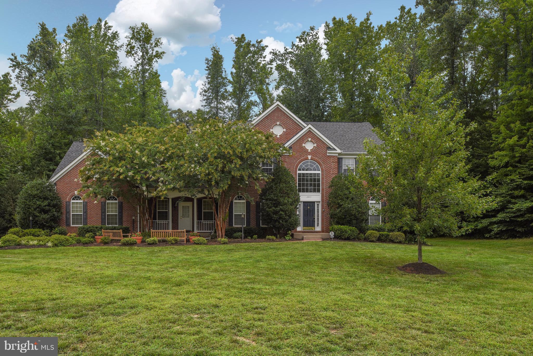 Stately Colonial with Stunning Open Floor Plan  6900 sq ft of Luxury. This former Model Home has Custom Features Throughout. Exquisite Trim Detail, Gourmet Kitchen, Dual Staircase, Sun room, Library, Lavish Owners Suite w/gas fp, Sitting Room and Luxury Bath. LL is perfect for Entertaining, w/Exercise rm, Rec Rm, 5th br (NTC) & full bath. 3.1 acres. 3 CAR GARAGE. Min to Marina,VRE, I-95& hospital.