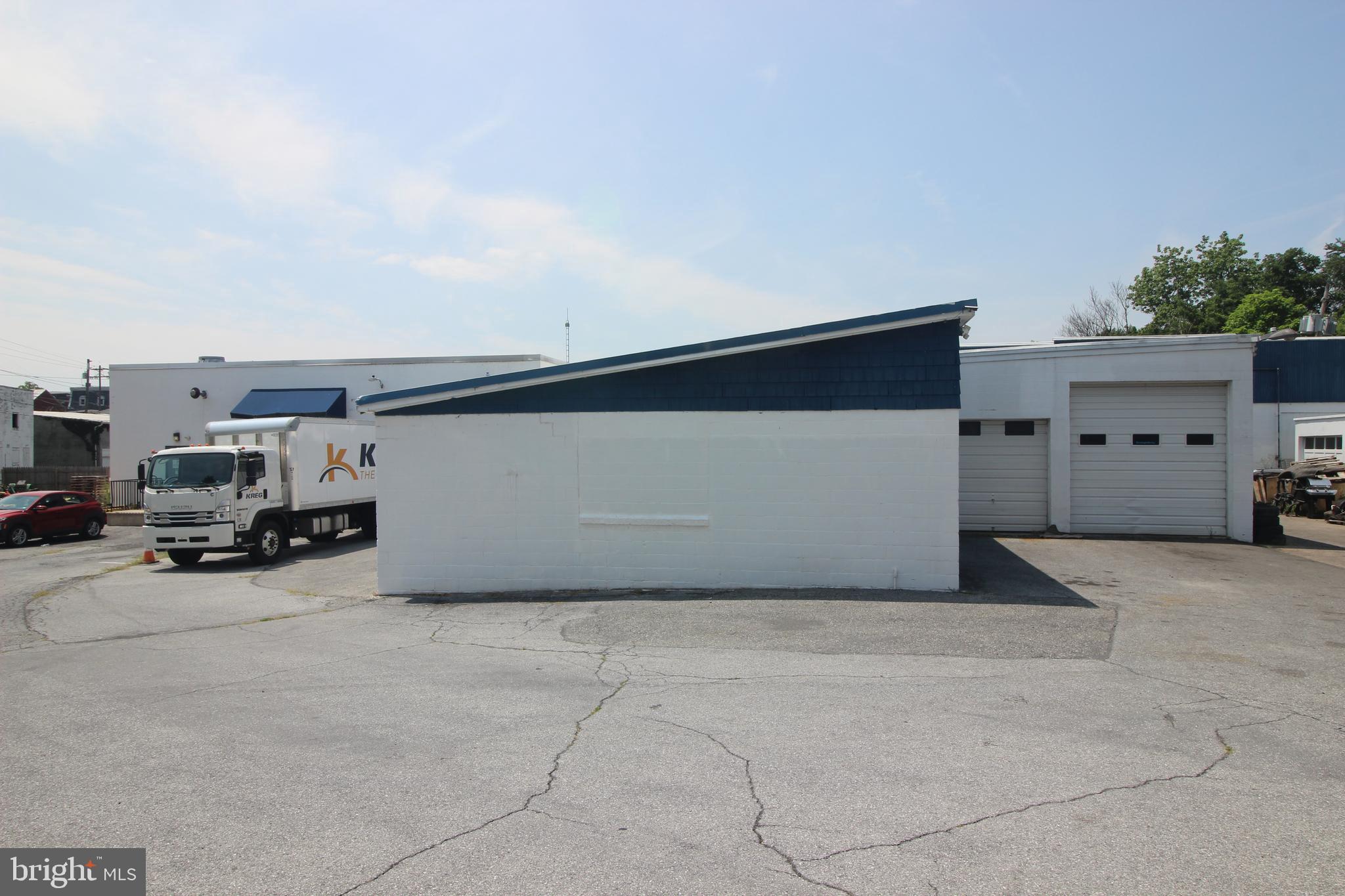 51-75 Primrose Street offers a compelling multi-tenant industrial investment opportunity with immediate income in place. Situated on approximately 2.25 acres, the property includes approximately 30,000 square feet across multiple buildings. The uses include supporting warehouse, self-storage, auto repair, countertop manufacturing and sales, distribution/sales of auto detailing products, and lawn tractor repair. The site has 400-amp three-phase electric service, and plans call for demolishing the three existing townhomes and replacing them with a 2,800-square-foot warehouse with two dock doors. Located just off Interstate 78, and Route 61, the property provides strong access and long-term investment potential.