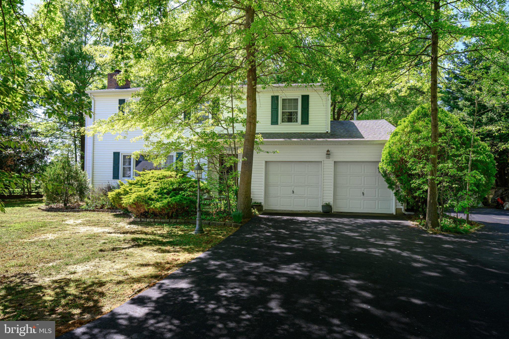 Two Story Colonial on 1.37+/- acre lot, rectangular 200 x 300 ft.  Approximately 2,700 sq ft. of living area in house (estimate).  4 bedrooms, 2.5 Bathrooms.  ½ basement with laundry room and fix-it shop/work bench with 2 crawl spaces.  Attached two-car garage with abundant built-in shelving and free-standing cabinets for lots of storage space with garage door opener on each of 2 doors.

Forced Hot Air, Fuel Oil Heating; Central Air Conditioning.  Well water pump upgraded in 2016. New, top-of-the-line “Meyers” well pump, with increased HP.  Public sewer so no septic systems to deal with.

Four upstairs Bedrooms. The MBR and BR2 are huge. MBR has slider door to lovely Sunroom/Sitting room.  The MBR features wainscotting on all walls; crown molding; custom wide molding around all 3 doors and the closet with  remote controlled ceiling fan with dimmable light.  Large living room with stunning fireplace. Wide, extra-long mantle, matching storage cabinets on both sides of fireplace, large picture window and crown molding.  Two full bathrooms with showers are upstairs, each with new, in 2024,  quiet, yet powerful Panasonic exhaust fan and LED light. One Powder Room is downstairs.

Bright and airy, extra-long dining room. Tray ceiling. dimmable LED ceiling lights on separate, inner and outer ring circuits for versatility. Ceiling centerline is pre-wired (includes 3-way switches) for one or more chandelier lights; Pass-through window to kitchen with fancy tempered glass shelf.

Family room with dropped ceiling bar area. Bar sink, granite counters, gorgeous glass door cabinets, wood-burning stove, versatile lighting, and a slider door to a the main level sunroom.

Modern, ample-sized kitchen with movable island. Nearly new, upscale glass cooktop/oven, dishwasher and microwave.  Build-in refrigerator surrounded by cabinets. Double sink,  disposal and PC workstation with shelving matching cabinet. Extraordinary lighting includes under and over cabinet lights plus a ceiling fan with fancy light globes and attractive light globes over sink.

MAJOR ADDITION & REHAB done in 2013: Extended DR by 13 feet and added 2nd story sunroom/sitting room on top of DR extension  Total rehab of 1st floor sunroom.   Top quality, long lasting architectural roof shingle for entire house; new flashing and roof vent seals. Both sunrooms have attractive, casement-style windows for exceptional ventilation.

Seven Ceiling fans with attractive lighting: MBR, BR2, BR3, 2nd story sunroom/sitting room, kitchen and 2 on the porch.  All four Slider Doors (servicing the porch and the 2 sunrooms) have built-in blinds for privacy and versatile light and view control.

Spacious screened porch with porch swing.  Massive stone and paver patio area includes three 10x10 ft flat, paved areas for table & chairs.  Large Campfire ring within the patio.  Two lovely, Amish garden sheds in excellent condition and loaded with options: 12x16 ft. shed installed in 2010, and a 10x14 ft. shed installed in 2021.  Huge 16x18 ft. Raised Deck using long-life Trex engineered planks; custom Pergola over one corner.   Deep Shaded, 10 x 12 ft Outer Patio Area with Pergola.  Mature Trees for great privacy and shade, especially around property perimeter.  Three-level, split rail fence on rear and side yard property lines. (Left-side fence only is owned and maintained by the neighbor.)

Extra-Wide Driveway.  Paved Parking for 10 vehicles! Also suitable for camping trailer or boat.