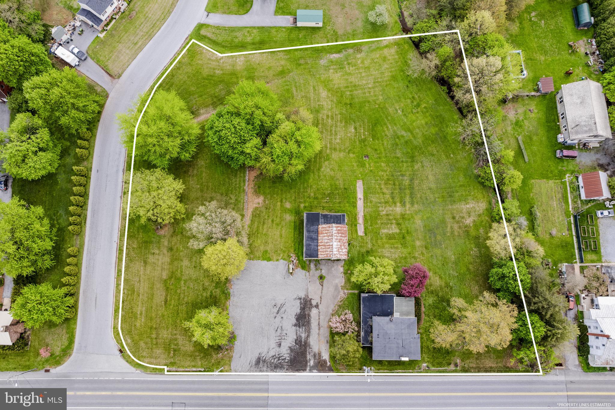 AUCTION DATE - MONDAY, JUNE 22, 2026, AT 4PM. LISTED PRICE IS AN OPENING BID ONLY AND IS NOT INDICATIVE OF THE FINAL SALE PRICE. REAL ESTATE: 2.4 ACRES commercial property Zoned Neighborhood Commercial w/2 sty. frame dwl. w/2176 SF finished area, kitchen, dining rm., living rm. w/stone fireplace, family rm., den, 4 bdrms., 1½ baths, full bsmt. w/outside entrance, oil HW heat. Outbldg.: Detached 1½ sty. gar./barn 38x34 w/2 large gar. bays & elec. all on level 2.4 ACRE lot w/326' road frontage along Rt. 625, (2) on-site well & (2) on-site sewer EDUs. Zoned Neighborhood Commercial w/potential uses included apt. dwl., retail, repair services, etc. NOTE: Tremendous opportunity to buy prime location. Four separate tracts totaling 2.4 ACRES selling all as one. Convenient location, minutes to Fivepointville, East Earl & Terre Hill. Terms 10% down, balance 60 days or before. Inspection at anytime.