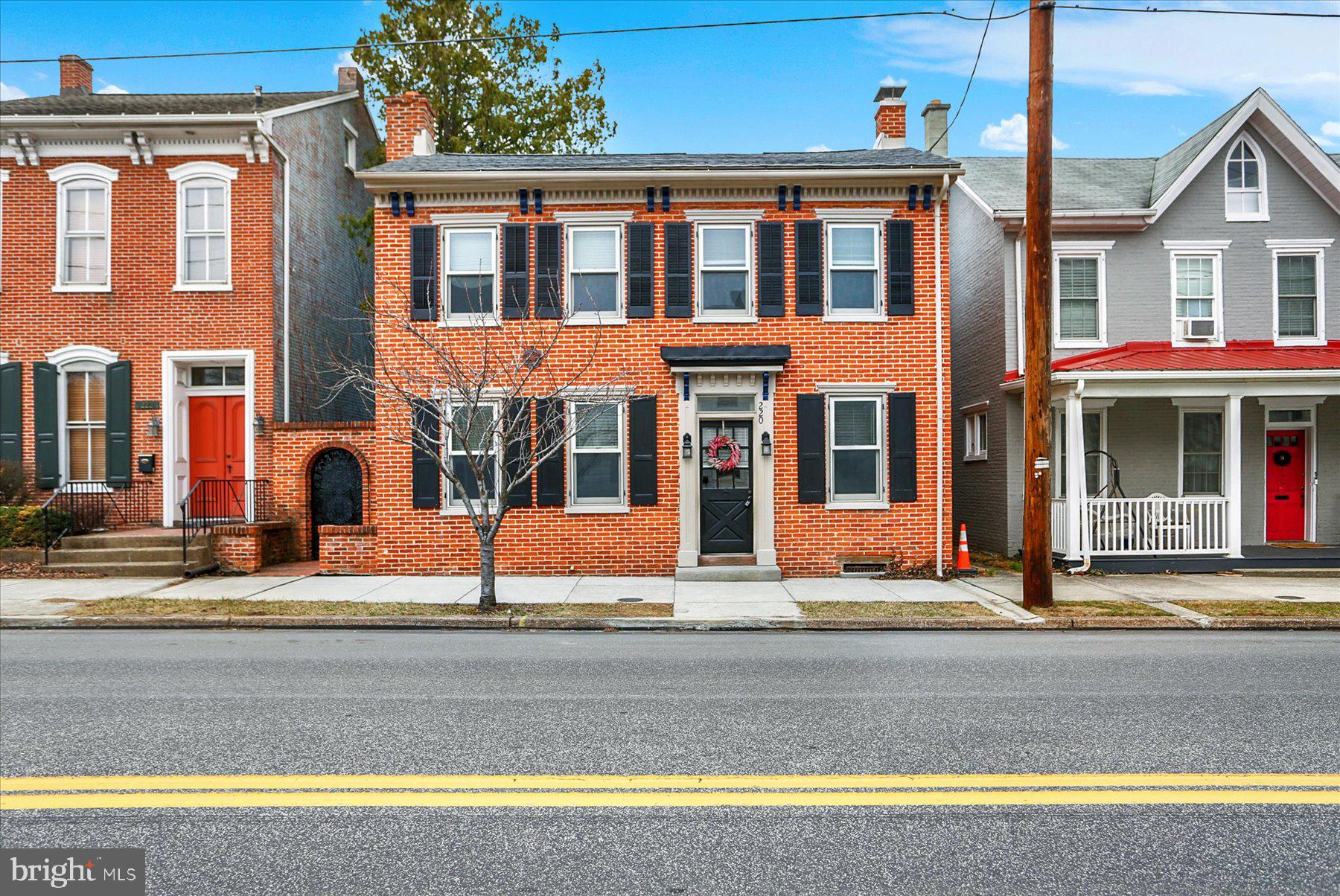 Welcome to 220 South Market Street, a beautifully updated home that seamlessly blends charm, character, and modern elegance. This fully remodeled residence offers a unique combination of classic features and contemporary style, making it an ideal place to call home.
The main house features a bright open kitchen with rich blue cabinetry, gold hardware, brand new granite countertops, tile backsplash and modern light fixtures, creating a stylish and inviting atmosphere. The two remodeled full bathrooms showcase sleek, contemporary finishes, while the open floor plan enhances the flow throughout the living spaces. First floor offers a living room and a cozy family room with a wood stove and hardwood floors adds warmth and comfort, and the second floor features all-new carpeting. Fresh paint throughout ensures every room feels bright and updated. Don’t miss the private balcony, offering a perfect spot for morning coffee or evening relaxation.
The detached office/studio is an ideal space for work or creativity, complete with its own gas fireplace, half bathroom, and kitchenette for added convenience. This private retreat provides the perfect balance of functionality and comfort. This space could also work as a "chill space".
Outside, you’ll appreciate the brand-new roof and low-maintenance brick exterior, providing both durability and curb appeal. The elegant wrought iron gate opens to a beautifully landscaped backyard with a covered rear patio, ideal for outdoor relaxation and entertaining.
Convenience is key, and this home offers two off-street parking spaces, ensuring parking is always a breeze. Located just a short walk from downtown Mechanicsburg, you'll have easy access to shops, restaurants, schools, and major highways.
220 South Market Street is a rare find, combining classic updates with modern living in a highly desirable location. Don’t miss your chance to experience all this home has to offer—schedule your showing today!