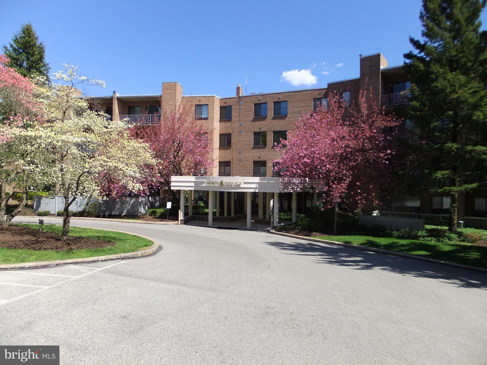 Welcome to the North Terrace Building at "Oak Hill Condominiums", Penn Valley, Pa. This home boasts new wood floors (2016) and great closet space. There is a coat closet in the foyer. The large living and dining area overlooks the large sunny balcony. The home features new remote-controlled window treatments and new light fixtures. New full-size vented LG washer/dryer. There is a large bedroom, a bath with a shower and a walk-in closet, 2nd bedroom, and a hall bath with a tub. Open Kitchen features lots of cabinets, a refrigerator, a tile floor, and more. Condo monthly includes hot and cold water, sewer, trash, and snow removal, exterior maintenance, and common area insurance. landscaping and parking. Balcony electric grills are permitted. Pool, tennis, pickleball, basketball, and gym are available. Clubhouse facility available for rental. Great Lower Merion Township Schools, Minutes to the center city via public transportation, #44 bus at the front door. xways and the nearby train. Convenient to Suburban Square, lots of shopping and restaurants all nearby. Home is leased until 4/30/27 $2575 per month plus electric