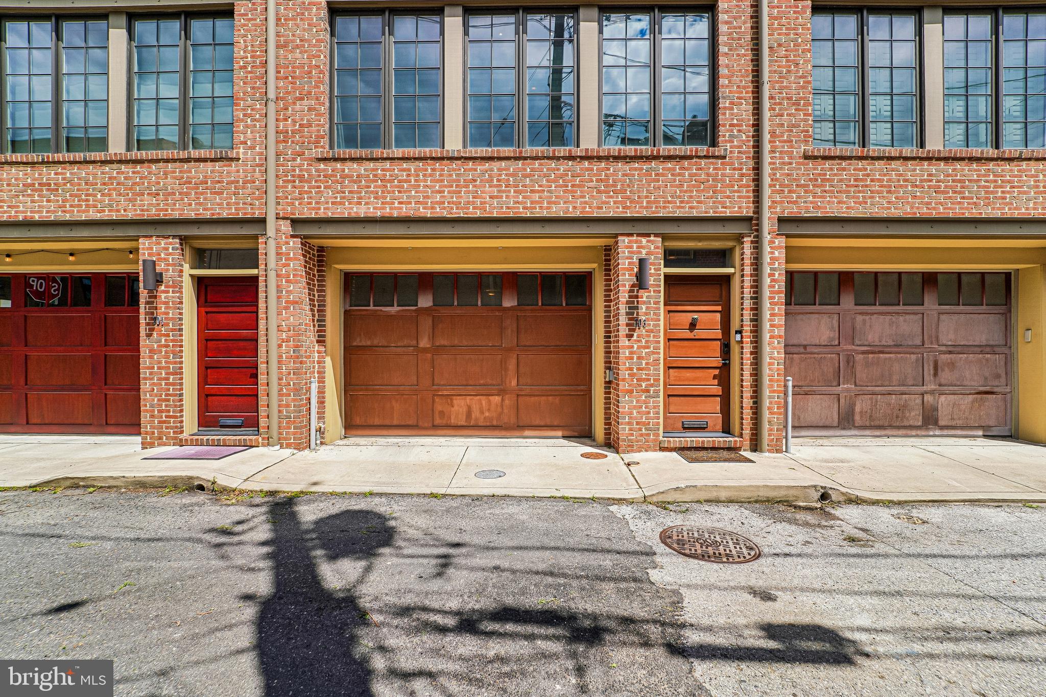 Welcome to 703 S Durham Street, a 2-bedroom, 2-bath home located in the historic Fells Point district, just two blocks from the waterfront. Offering a unique combination of location and functionality, this property provides the benefits of living in a historic district while featuring many of the conveniences and updates associated with newer construction.

The interior features an open-concept loft-style layout, exposed brick accents, and thoughtfully designed living spaces that provide flexibility for a variety of uses. The kitchen and living areas are designed for both everyday living and entertaining, while the well-appointed bedrooms and full baths offer comfortable accommodations.

Additional highlights include a rare two-car garage, a tankless water heater, recently replaced front-loading washer and dryer, owned solar panels that may help reduce energy costs, and multiple outdoor living areas. A rear deck with a spiral staircase leads to a rooftop deck, providing additional space for relaxation, dining, or enjoying city views.

Conveniently located near local dining, shopping, entertainment, and commuter routes, this home offers easy access to a variety of neighborhood amenities and attractions.

An assumable VA loan with a 2.75% interest rate may be available to qualified buyers. Contact the listing agent for additional details and eligibility requirements. Schedule your tour today to experience all that 703 S Durham Street has to offer.