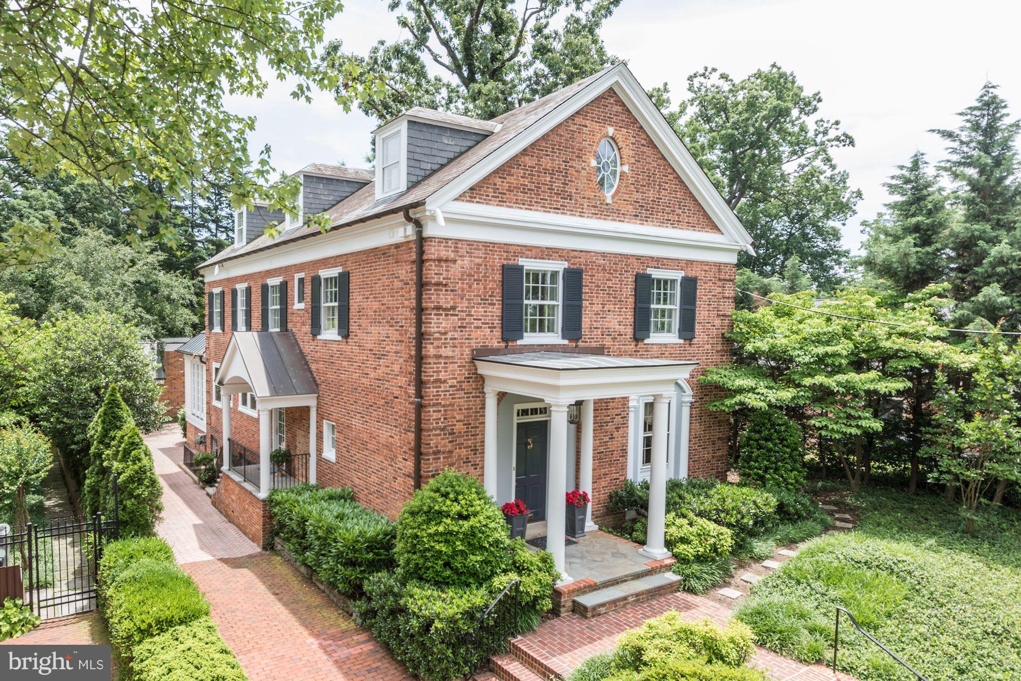 $250,000 price reduction.   Large,elegant, living and entertaining space in this Georgian style home. Move in condition in the heart of Massachusetts Avenue Heights off of Woodland Drive. Five large bedrooms and four full baths on two upper floors. Owners suite with spa-like bath and walk-in closets. Fantastic Great room addition plus garage and driveway parking.