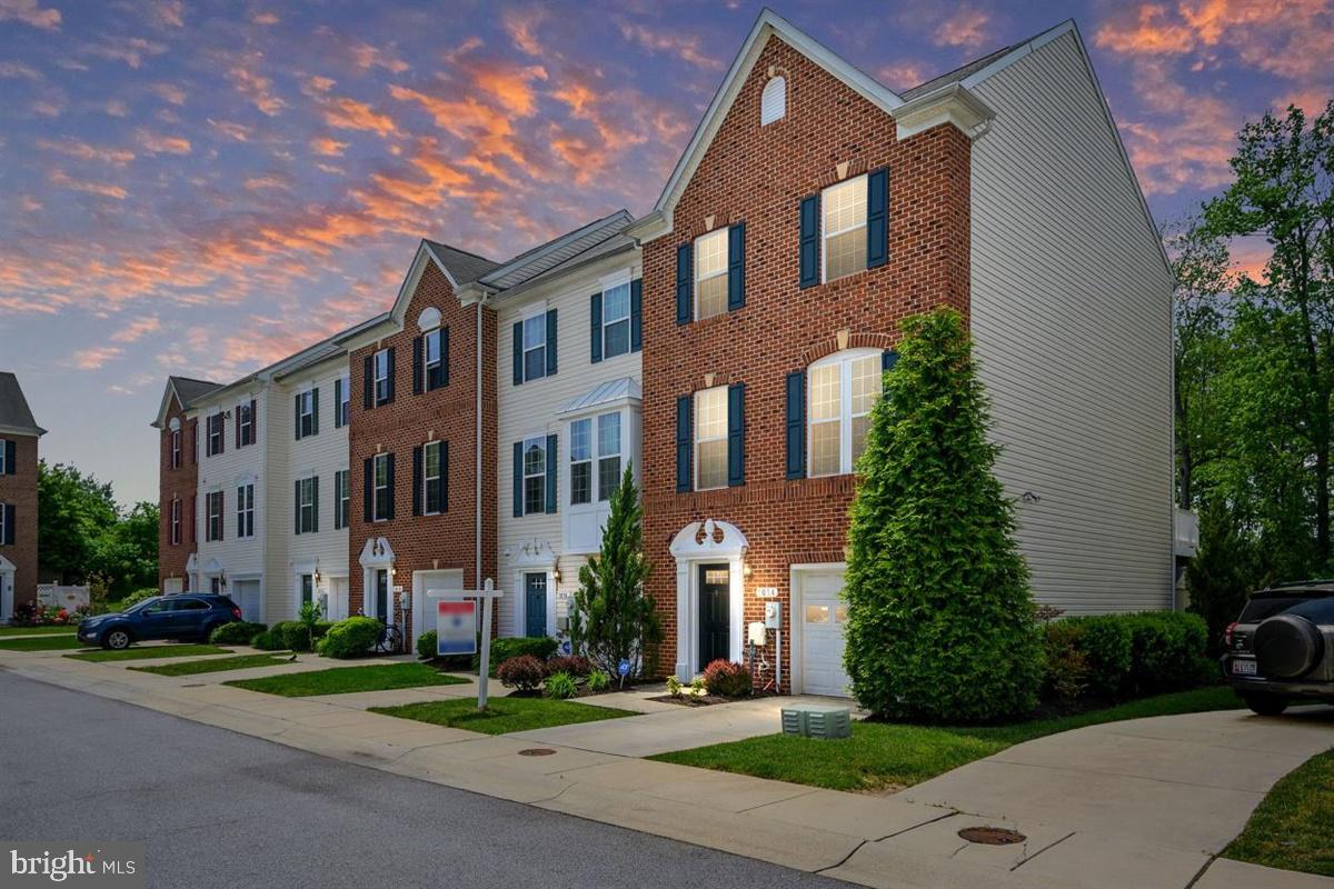 3D tour:  https://unbranded.youriguide.com/1014_wisdom_ct_glen_burnie_mdWelcome to 1014 Wisdom Court, the former model home for The Preserve at Pine Ridge.  The end unit is boasting OVER 2100 sq ft.  Rare to find this much square footage!!! When you enter the home you are greeted with a clean and fresh foyer.  To your left is a half bathroom for the lower level.  To the right is the bonus finished living space that is perfect for an office and storage space.  Moving down the hallway it opens up to your large Family Room.  Outside off the Family Room is the lower level paver patio.  Moving upstairs to the second level, you have upgraded hardwood stairs, the Living Room, Kitchen, and Deck.  This level is wide open!!! The Living Room is HUGE and the entire level has hardwood floors.  The massive upgraded kitchen is perfection.  Large kitchen island, granite counter tops, tile backsplash, large pantry and space for a kitchen table.  Off of the kitchen is the large trex deck.  Private deck with this being the end unit.  Up to the third level is another set of upgraded hardwood stairs and where you have the 3 bedrooms, 2 full bathrooms and laundry room.  The 2 front bedrooms offer great closet space!  The hallway full bathroom is upgraded with tile floors and a floor to ceiling tile shower.  The Master Suite is large, open and offers 2 closets!!! Yes His and Hers!!! The master bathroom has a ton of upgrades, tile floors, granite double sink vanity, tile soaking tub, and floor to ceiling tile shower.  This end unit has everything you are looking for!!! Convenient location to all major routes, shopping and restaurants.  Come claim this home and make it yours!!!
