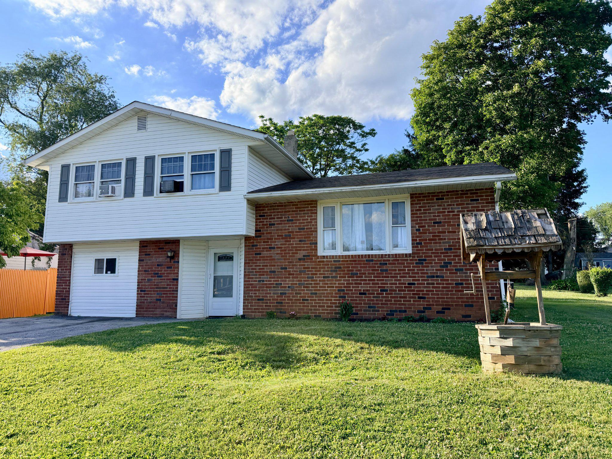 This charming split-level home offers an excellent opportunity to update and personalize to your taste. With three spacious bedrooms, and in-law suite with its own bathroom, this home's layout is designed to accommodate your lifestyle needs and provides the perfect canvas for your vision. The unfinished basement provides ample storage space. Set on a generous 0.26-acre lot, the property boasts a level yard, perfect for outdoor activities or gardening. With a driveway that accommodates up to four vehicles, parking is never a concern. The exterior, featuring a brick facade and vinyl siding, ensures low maintenance while enhancing curb appeal. This home is not just a place to live; it's a canvas for your future memories. Experience the comfort and warmth of a home that will truly feel like your own. Don't miss the opportunity to make this residence your next home sweet home!