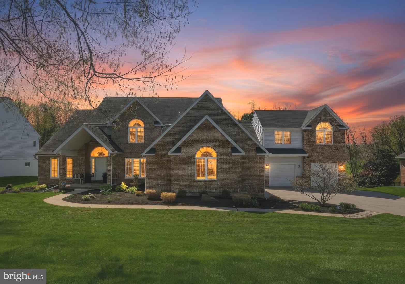 Exceptional custom residence offering over 6,000 finished square feet, a rare 5-car garage, and an outstanding location in highly desirable Patapsco Park Estates within the sought-after Mt. Hebron High School district. This distinctive home combines space, functionality, and convenience in a way that is rarely available in Ellicott City, providing estate-style living without sacrificing proximity to major commuter routes, shopping, dining, parks, and everyday conveniences.

Designed for both entertaining and comfortable daily living, the home features hardwood flooring on two levels, generously sized living areas, an updated gourmet kitchen with premium finishes, dramatic dual-sided fireplace, finished walkout lower level with theater/media space and wet bar, and an impressive 663-square-foot TimberTech composite deck with integrated lighting. Abundant windows fill the home with natural light while thoughtfully designed spaces create warmth, character, and flexibility throughout.

Car enthusiasts, collectors, hobbyists, and buyers seeking exceptional garage and storage capacity will immediately appreciate the rare 5-car garage and expansive driveway parking—features seldom found this close to the heart of Ellicott City. Whether hosting gatherings, pursuing hobbies, working from home, or simply enjoying extra space, this property offers a lifestyle that is difficult to duplicate in today's market.

A private upper-level 2-bedroom suite provides additional flexibility for guests, extended stays, home office space, fitness room, creative studio, or other evolving lifestyle needs. Rare opportunity to own a one-of-a-kind custom home offering space, convenience, garage capacity, and long-term value in one of Howard County's most desirable communities.