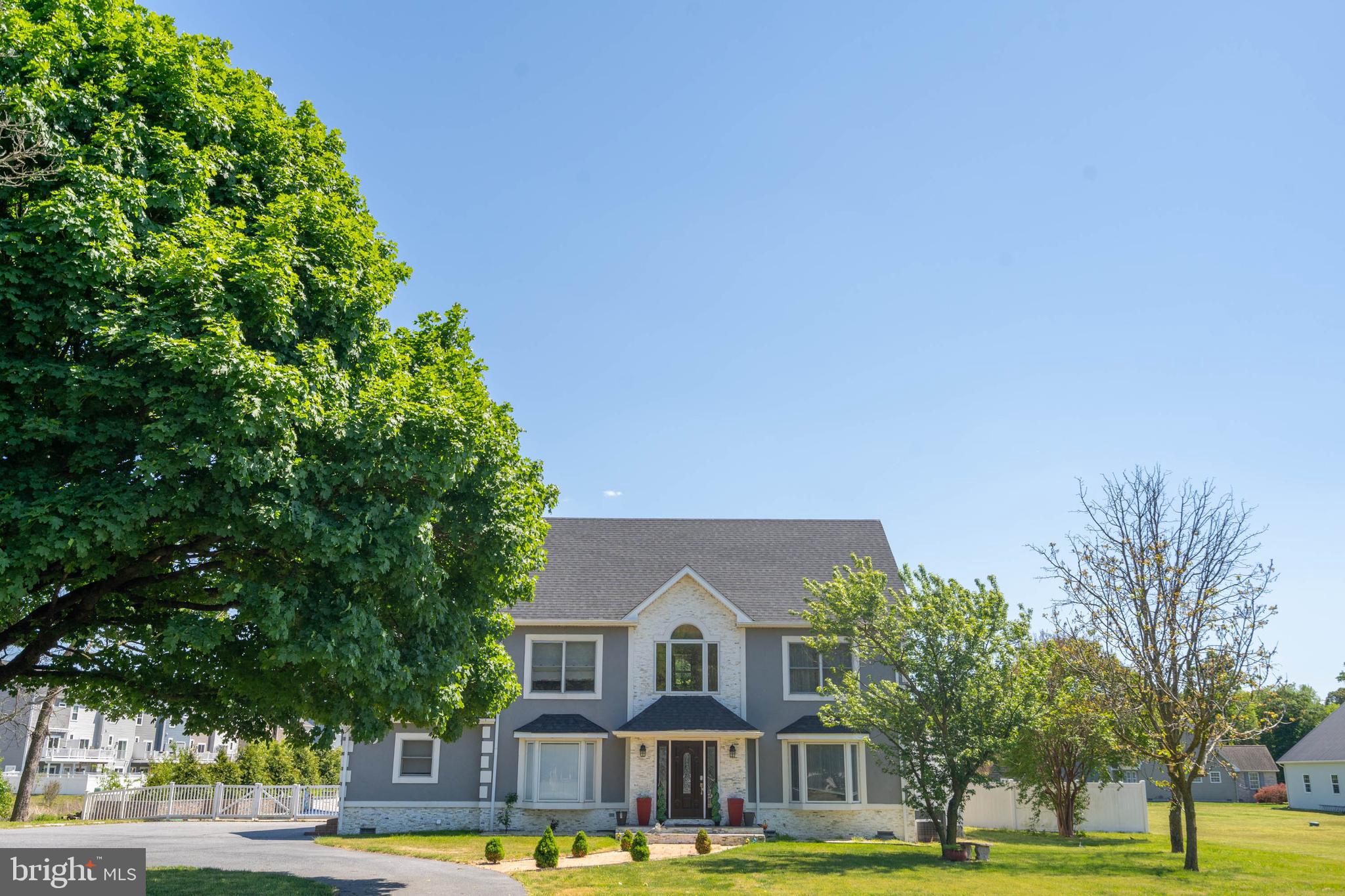 Welcome to an extraordinary PRIVATE RETREAT just outside the heart of Millsboro where resort-style outdoor living, exceptional space, and everyday convenience come together to create a truly one-of-a-kind property. Perfectly positioned near Millsboro’s major shopping district, this remarkable home offers easy access to all essential needs including grocery stores, hardware stores, pet stores, restaurants, and daily conveniences, while also providing an ideal location for commuters traveling to Berlin, Salisbury, Milford, and surrounding coastal destinations.
This impressive 6-bedroom, 4-bath property is designed to deliver the perfect balance of luxury, functionality, and lifestyle. Step outside to discover the show-stopping BACKYARD OASIS that transforms this home into a private resort. The STUNNING IN-GROUND POOL with a captivating waterfall feature creates a peaceful, vacation-inspired setting, while the hot tub offers year-round relaxation. The outdoor kitchen and bar area make this an entertainers dream while the expansive deck provides incredible space for outdoor dining, entertaining, or simply enjoying the beautifully designed surroundings. Charming gas lights create a warm and magical ambiance for evenings under the stars, while the gazebo offers the perfect shaded retreat—making every day feel like a getaway.
Inside, the thoughtfully designed multi-level floor-plan provides outstanding flexibility for large households, entertaining, or MULTI-GENERATIONAL LIVING. The main level features two bedrooms, including a spacious primary suite for convenience and accessibility. The second floor offers three generously sized bedrooms connected by a desirable Jack-and-Jill bath layout, while the third-floor suite serves as an extraordinary private retreat with an expansive sleeping area, dedicated living space, and full bathroom.
Whether you are hosting unforgettable poolside gatherings, accommodating guests with ease, or simply enjoying the unmatched combination of privacy and proximity to everything Millsboro has to offer, this exceptional property delivers a rare opportunity to own a home that truly combines luxury living with everyday practicality. With easy access to Delaware beaches, Maryland’s Eastern Shore, and key commuter routes, this home offers the lifestyle, location, and versatility today’s buyers are searching for.